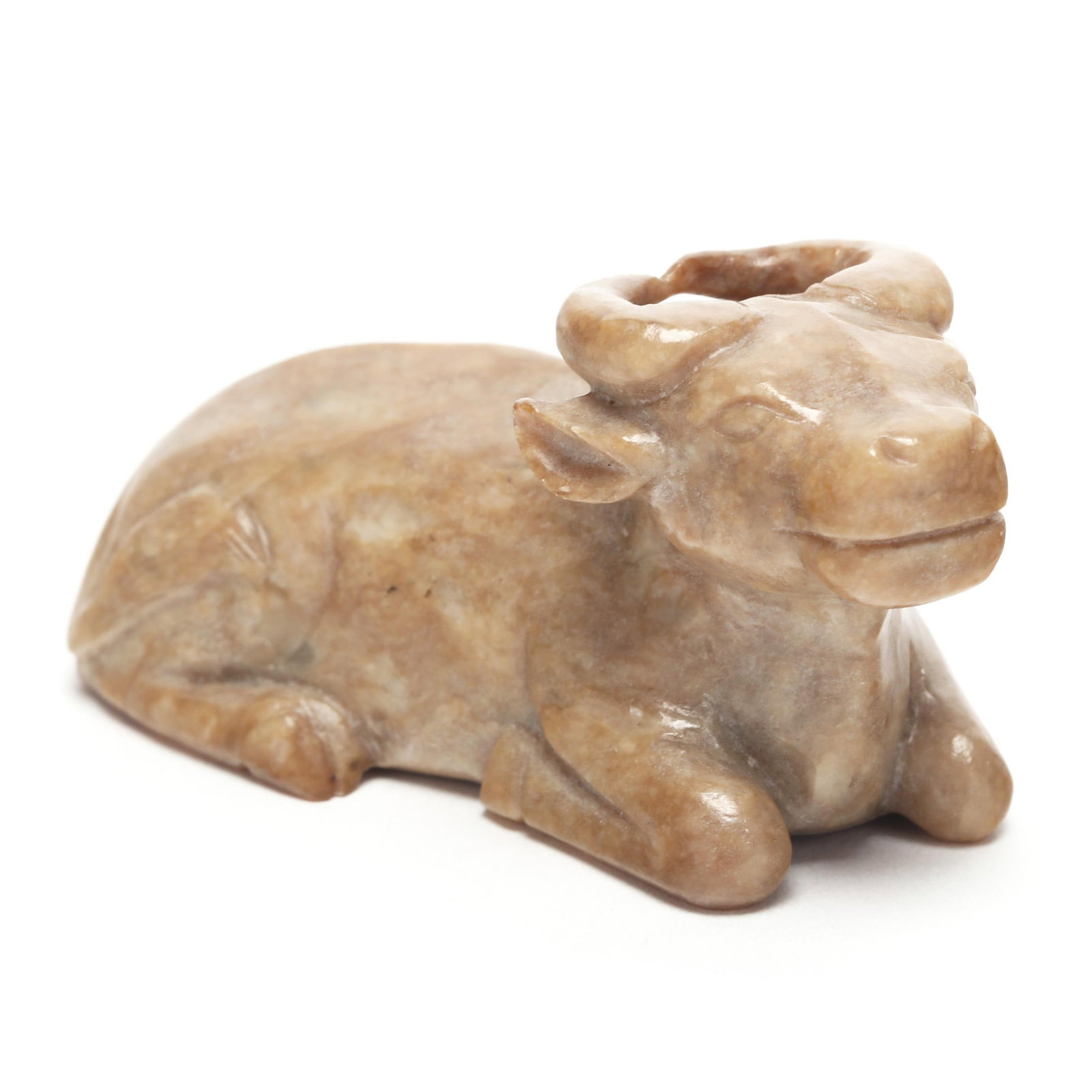 A Chinese Carved Jade Recumbent Water Buffalo: A Chinese Carved Jade Recumbent Water Buffalo Ming dynasty (1368-1644), a very well carved buff colored nephrite jade water buffalo at rest, his legs are folded underneath his body with articulated ho