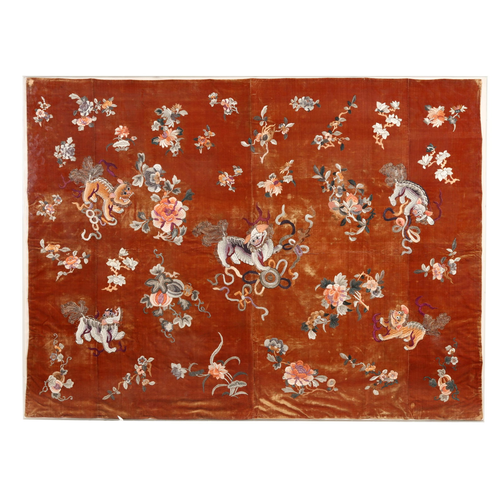 A Chinese Red Velvet Embroidery with Buddhist Lions: A Chinese Red Velvet Embroidery with Buddhist Lions Qing dynasty (1644-1912), late 18th or early 19th century, velvet embroidered with polychrome silk, gold and silver wrapped thread, four vertical pa