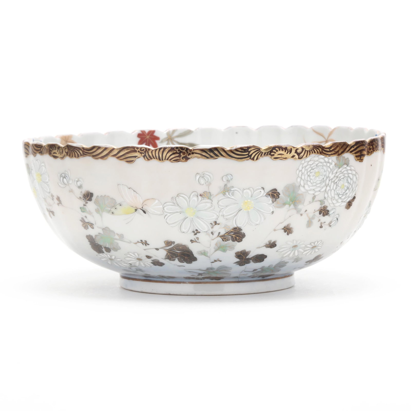A Japanese Porcelain Chrysanthemum Form Bowl: A Japanese Porcelain Chrysanthemum Form Bowl Meiji or Taisho period, early 20th century, porcelain hand painted with enamels and gilt, finely painted with chrysanthemums, butterflies, and autumn grass