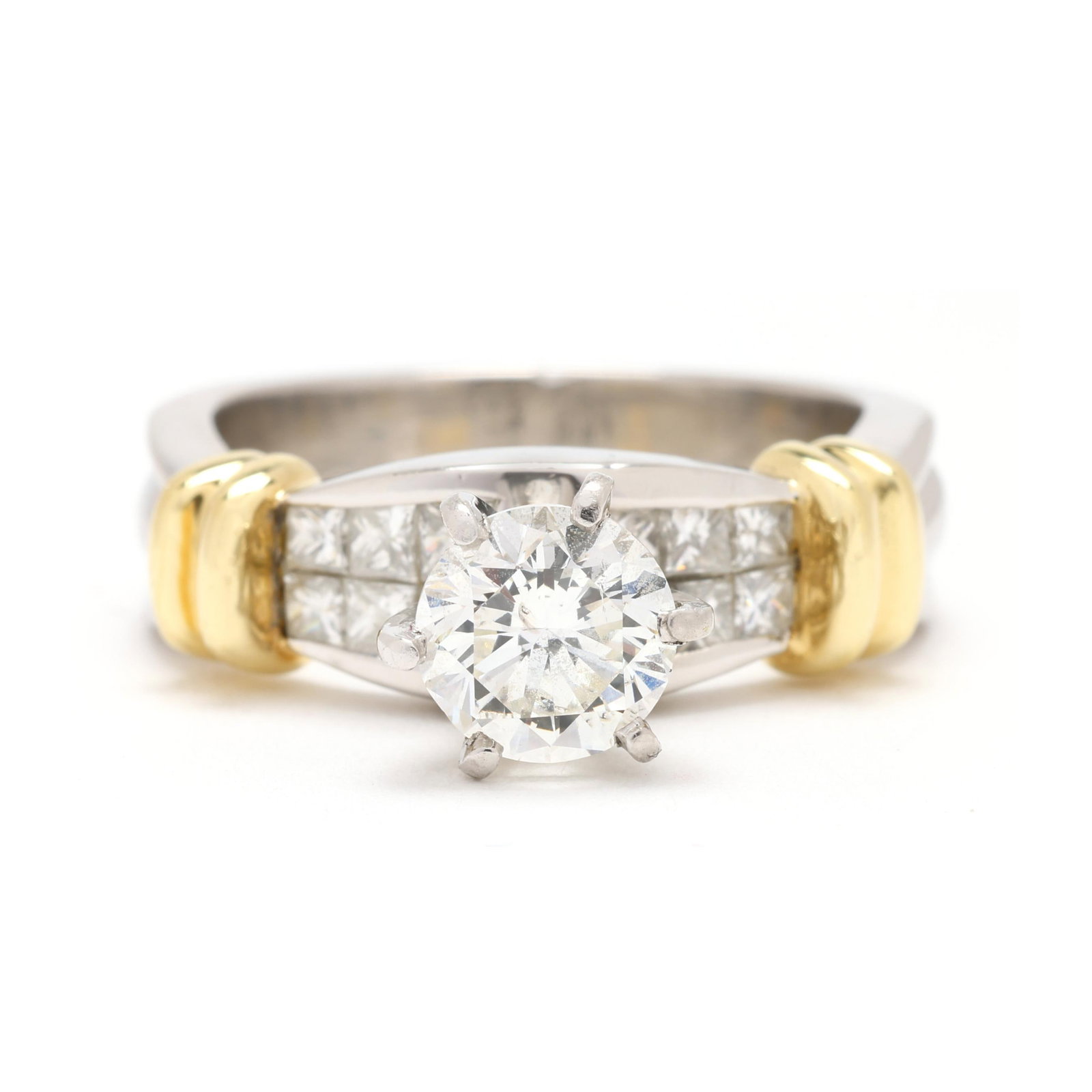 Platinum, Gold, and Diamond Ring: Platinum, Gold, and Diamond Ring centered on a high prong set round brilliant cut diamond (6.15 - 6.20mm) weighing approximately .90 carat (I color, I1 clarity), the shoulders invisibly set with princ