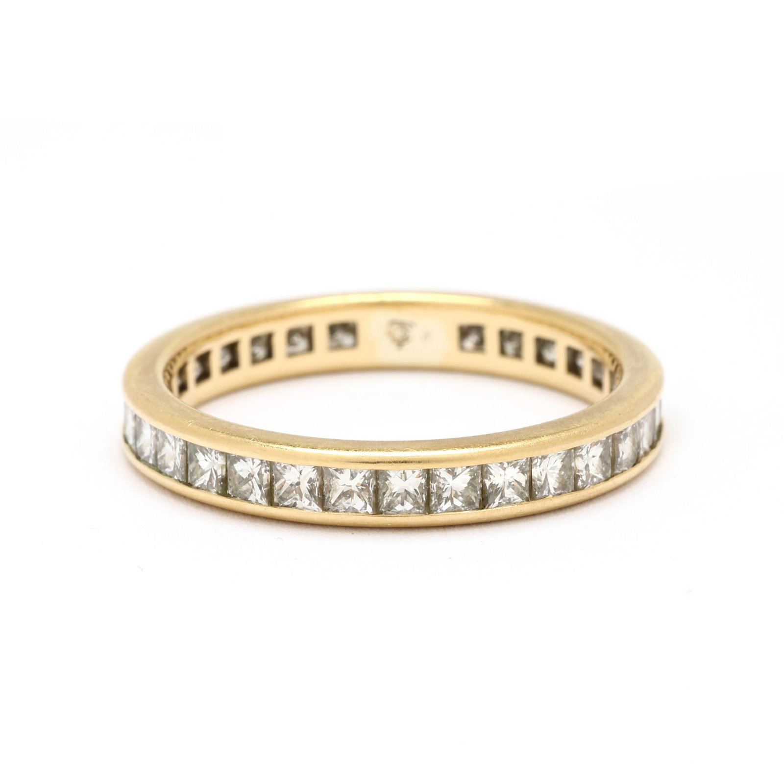 Gold and Diamond Eternity Band, Tiffany & Co.: Gold and Diamond Eternity Band, Tiffany & Co. gold band channel set with princess cut diamonds weighing approximately 1.0 total carat (G-H color, VS1-SI1), stamped with maker's mark, XRF testing 18KT.