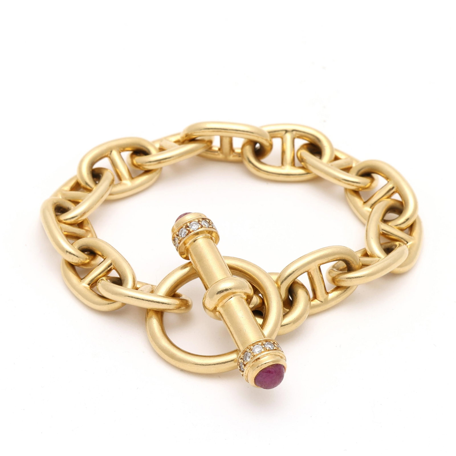Gold, Ruby, and Diamond Mariner Link Bracelet, Lilli of Miami: Gold, Ruby, and Diamond Mariner Link Bracelet, Lilli of Miami mariner link chain bracelet, completed with a toggle clasp, the terminals of the bar set with round cabochon cut rubies (6mm) and with ful