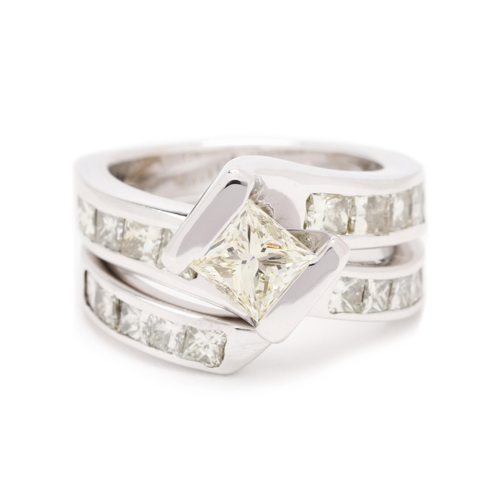 White Gold and Diamond Ring and Band: White Gold and Diamond Ring and Band the ring in a bypass design centered on a diagonally set princess cut diamond (5.2 x 5.0mm) weighing approximately .75 carat (M color, VS2 clarity), channel set to