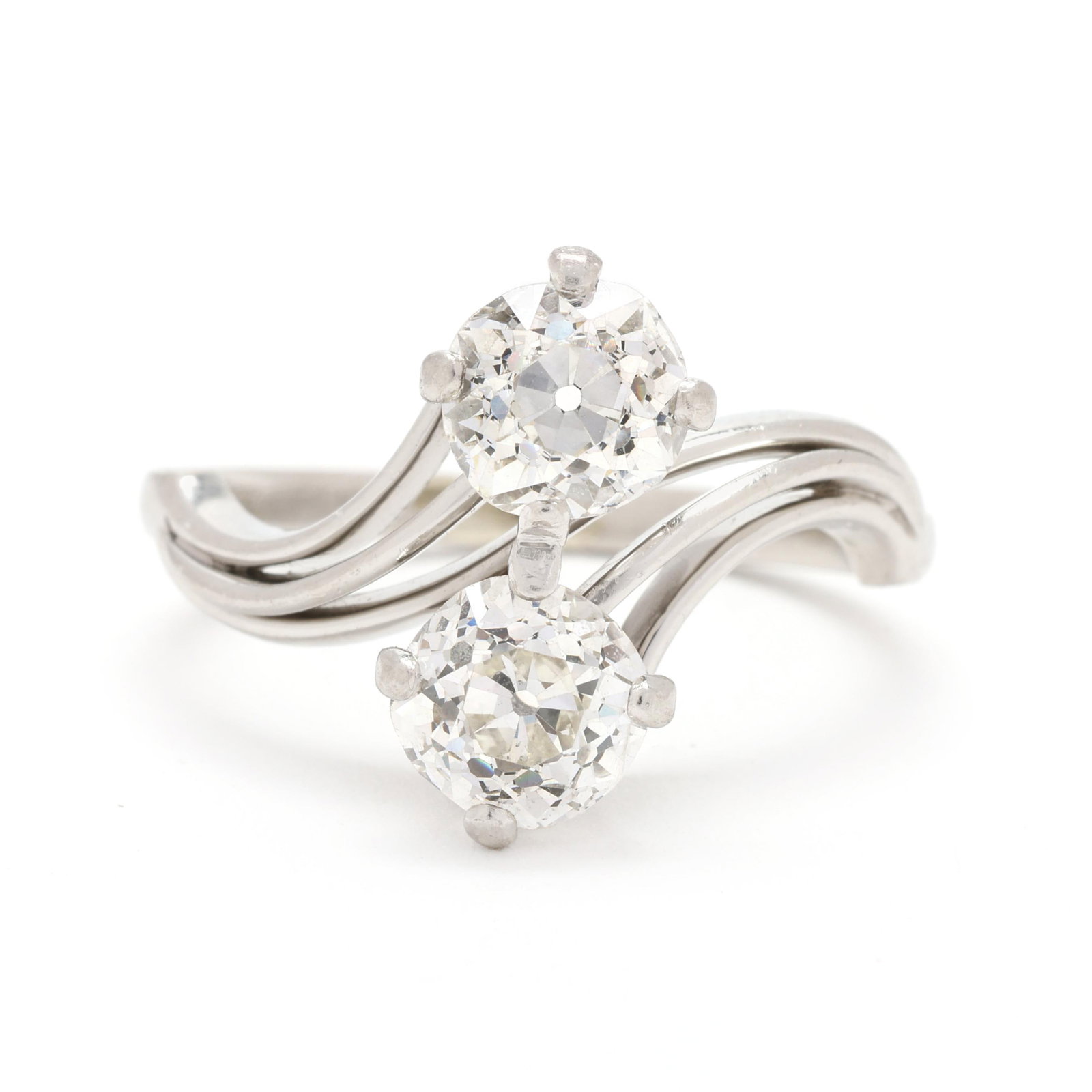 Vintage Platinum and Diamond Bypass Ring, Jabel: Vintage Platinum and Diamond Bypass Ring, Jabel designed in a swirl motif, set with two old mine cut diamonds (5.93 - 5.75 x 4.09mm; 5.96 - 5.88 x 4.00mm) weighing approximately 2.00 total carats (K-L