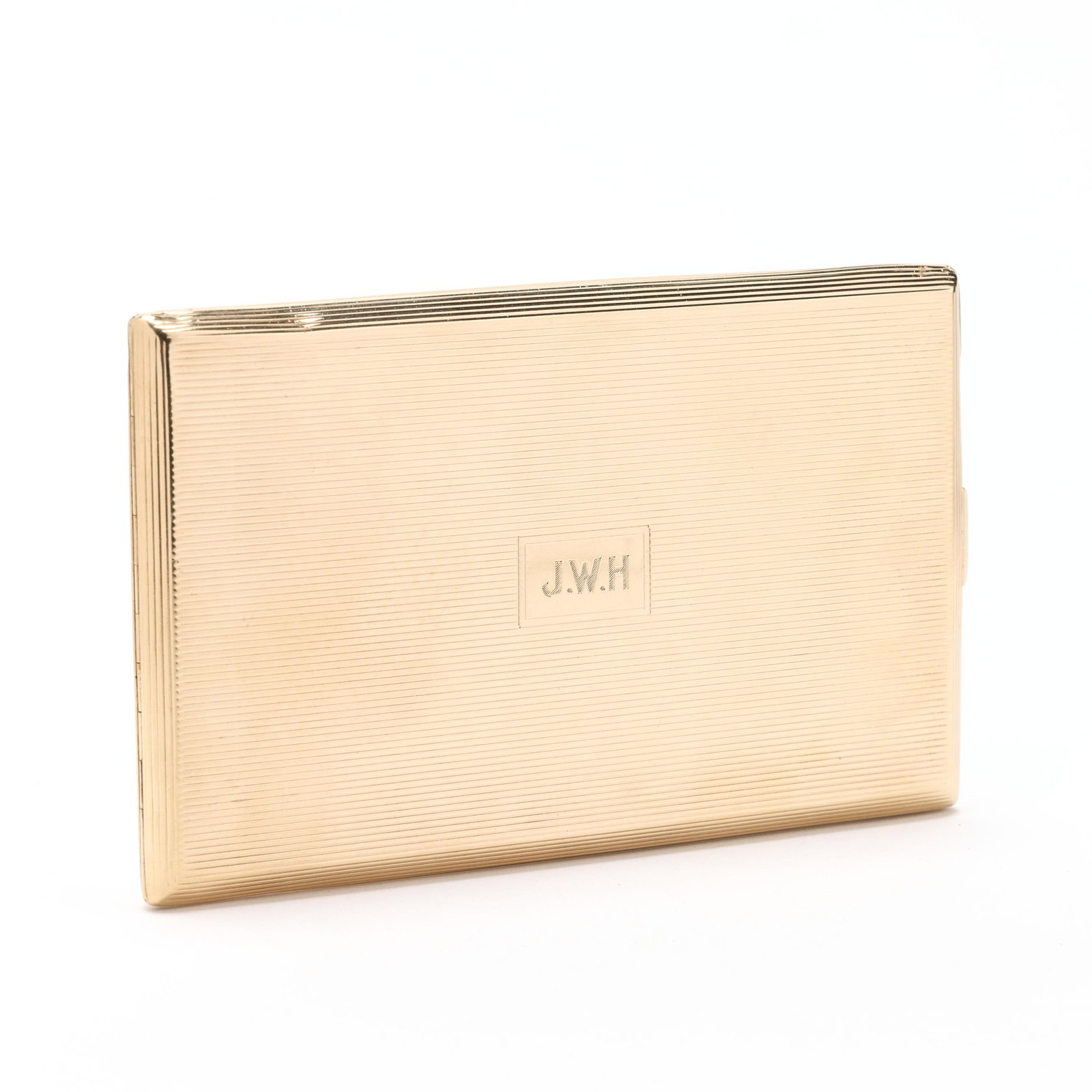 Vintage Gold Case, Cartier: Vintage Gold Case, Cartier the rectangular gold case with engine turned fluting to exterior, and with central cartouche containing the monogram J.W.H., with push button latch, with open interior and r