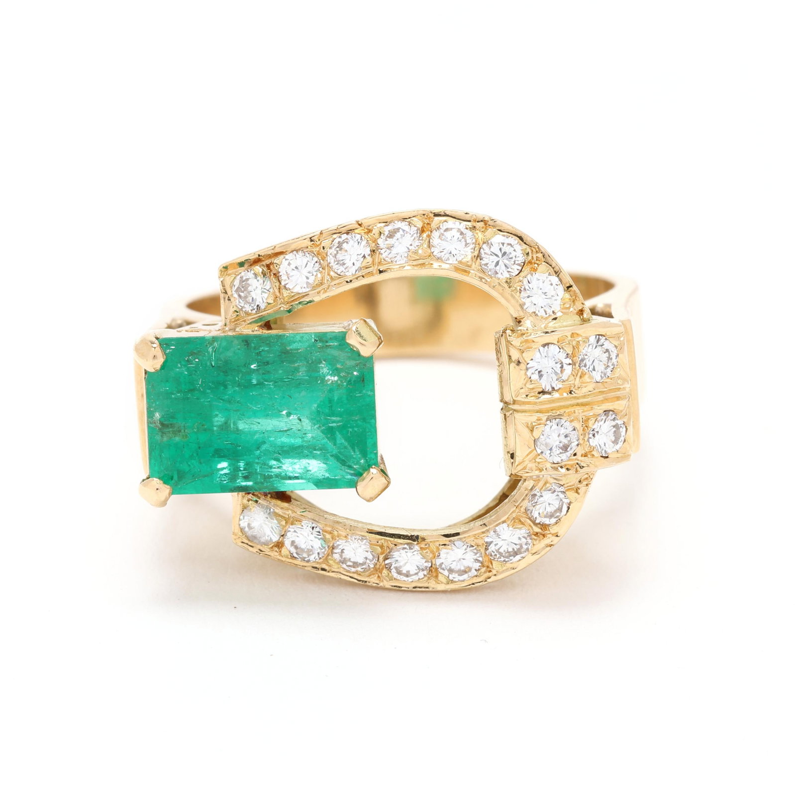 Gold, Diamond, and Emerald Buckle Motif Ring: Gold, Diamond, and Emerald Buckle Motif Ring buckle design with an offset emerald cut emerald (9.3 x 6.5 x 5.2mm) weighing approximately 2.5 carats, the buckle bead set with full cut round diamonds we