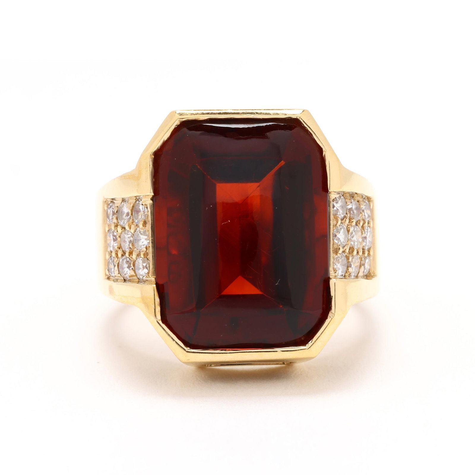 Gold, Diamond, and Citrine Ring, Gump's: Gold, Diamond, and Citrine Ring, Gump's centered on a half bezel set emerald cut buff top citrine (16.20 x 12.05 x 8.52mm), the shoulders bead set with full cut round diamonds weighing approximately .
