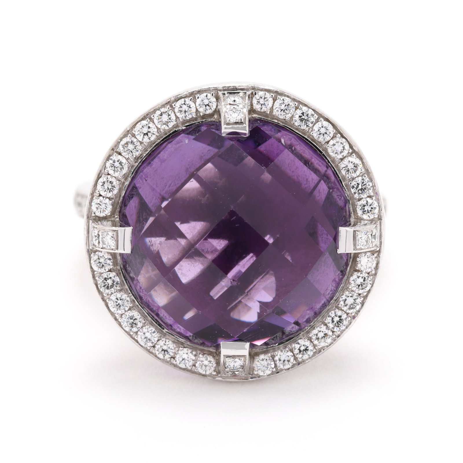 White Gold, Amethyst, and Diamond Ring, Chaumet: White Gold, Amethyst, and Diamond Ring, Chaumet from the Attrape-moi...si tu m'aimes collection, centered on a round checkerboard cut amethyst (14.5mm) the halo, prongs, and shoulders set with full cu