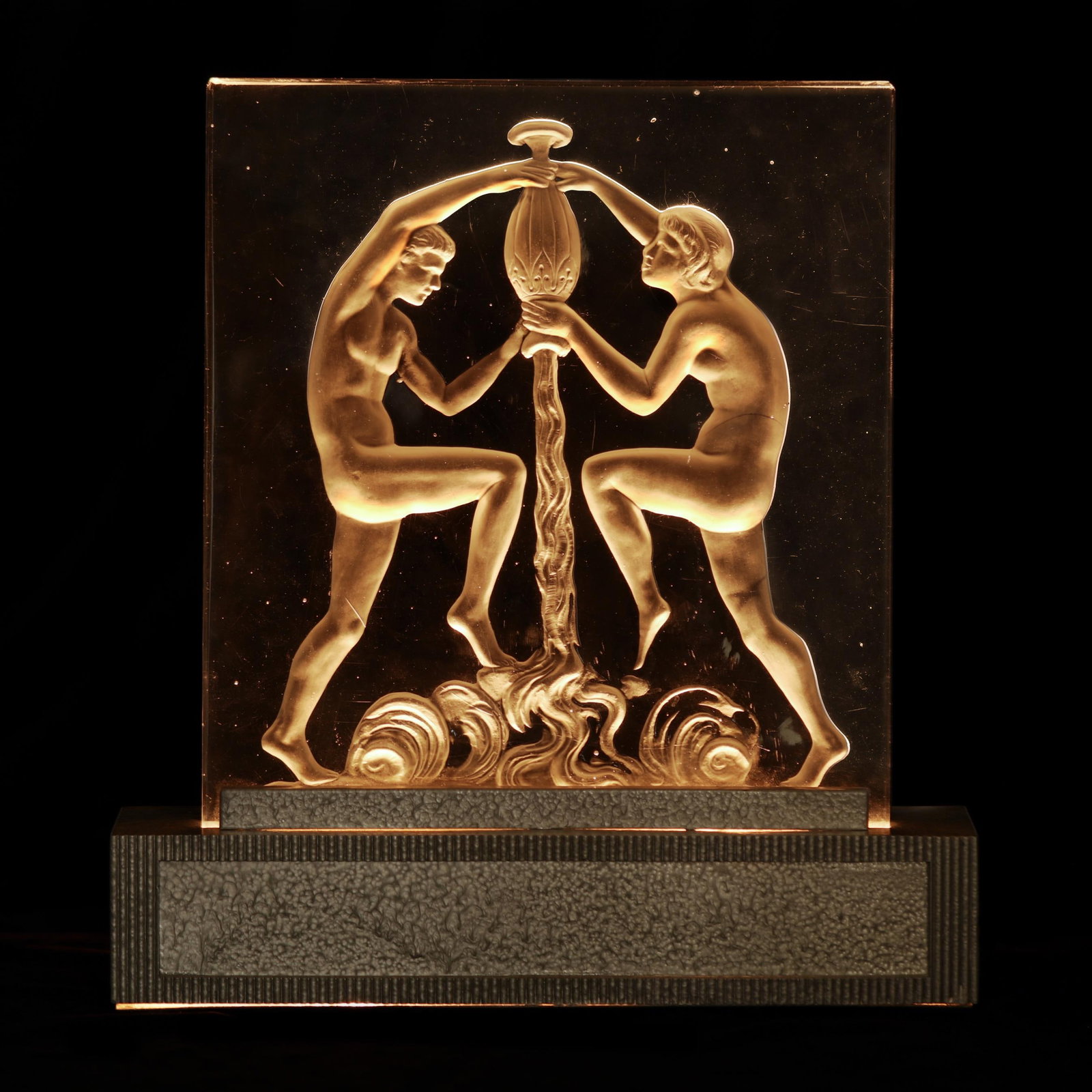 Steuben, Art Deco Figural Panel Luminor: Steuben, Art Deco Figural Panel Luminor New York, circa 1925, shape 8461, clear glass panel with verso engraved nude man and woman pouring out an amphora, unmarked, with period silver painted metal