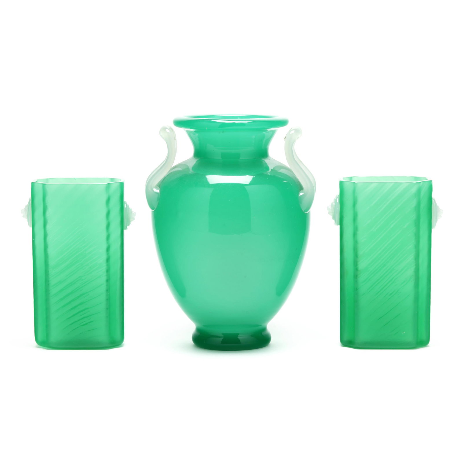 Steuben, Three Piece Assembled Jade Garniture: Steuben, Three Piece Assembled Jade Garniture New York, circa 1920-1930, including a baluster vase with applied opaline handles (10 x 7 in. diameter) and a pair of rectangular swirl vases with