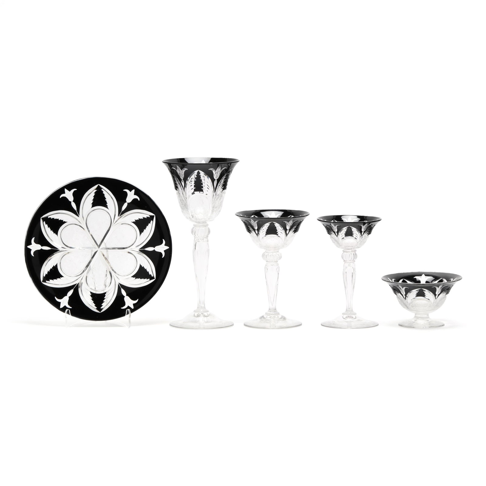 (32) Pieces of Rare Steuben Mirror Black Cut-to-Clear Crystal Tableware: (32) Pieces of Rare Steuben Mirror Black Cut-to-Clear Crystal Tableware New York, circa 1920, thick cut rock-crystal engraved black over clear crystal, including (7) plates (8.5 in. diameter); (5)