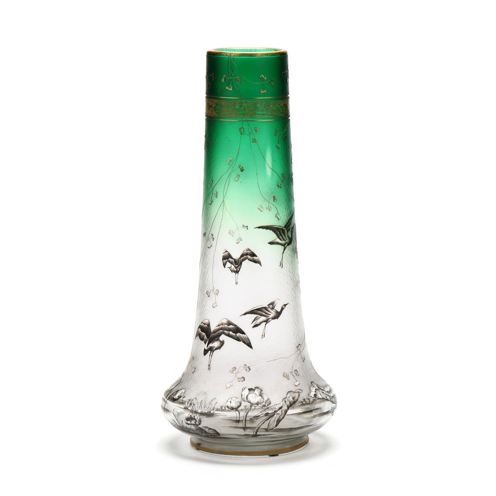 Daum Nancy, A Fine Enameled and Etched Glass Vase with Herons: Daum Nancy, A Fine Enameled and Etched Glass Vase with Herons circa 1894, of tapering cylindrical form raised on bun foot, the clear and acid textured ground transitioning toward green at the apex,