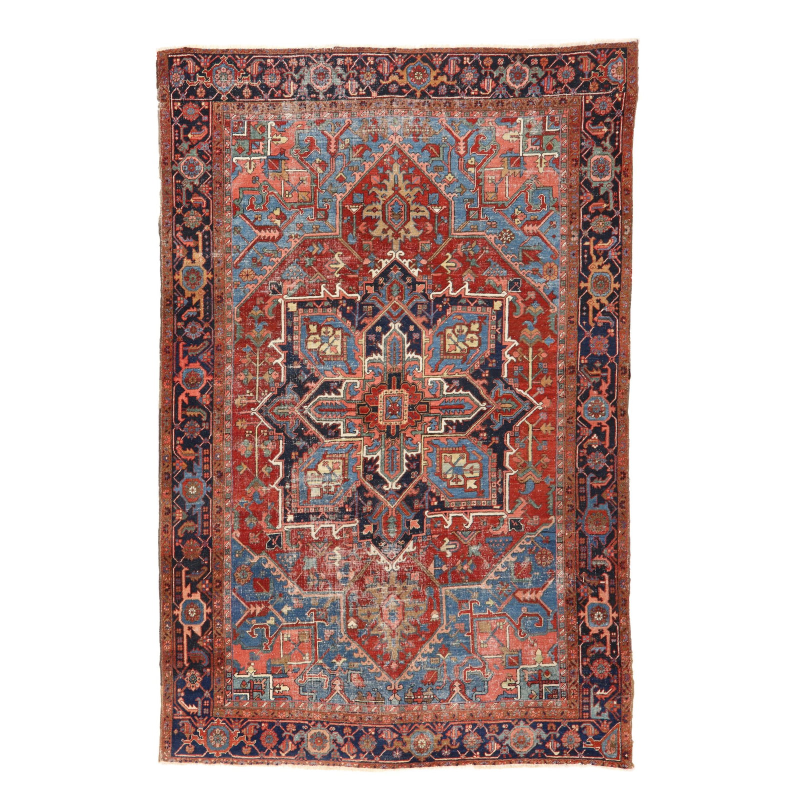 Semi-Antique Heriz Room Size Carpet: Semi-Antique Heriz Room Size Carpet wool on cotton foundation, the central blocky starburst medallion in blues and reds, on a red field with stylized foliate motifs, the blue and pink spandrels filled