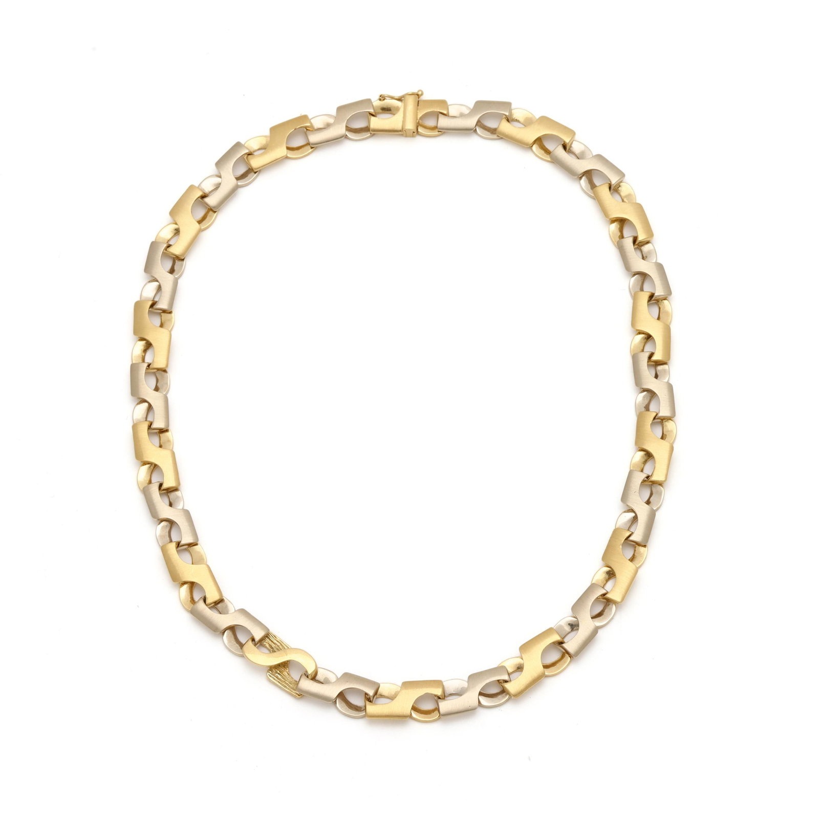 Bi-Color Gold Necklace: Bi-Color Gold Necklace the necklace in an alternating, bi-color, sculptural link design with combination smooth and striated finishes, completed with a fold over clasp with figure eight safety, stampe