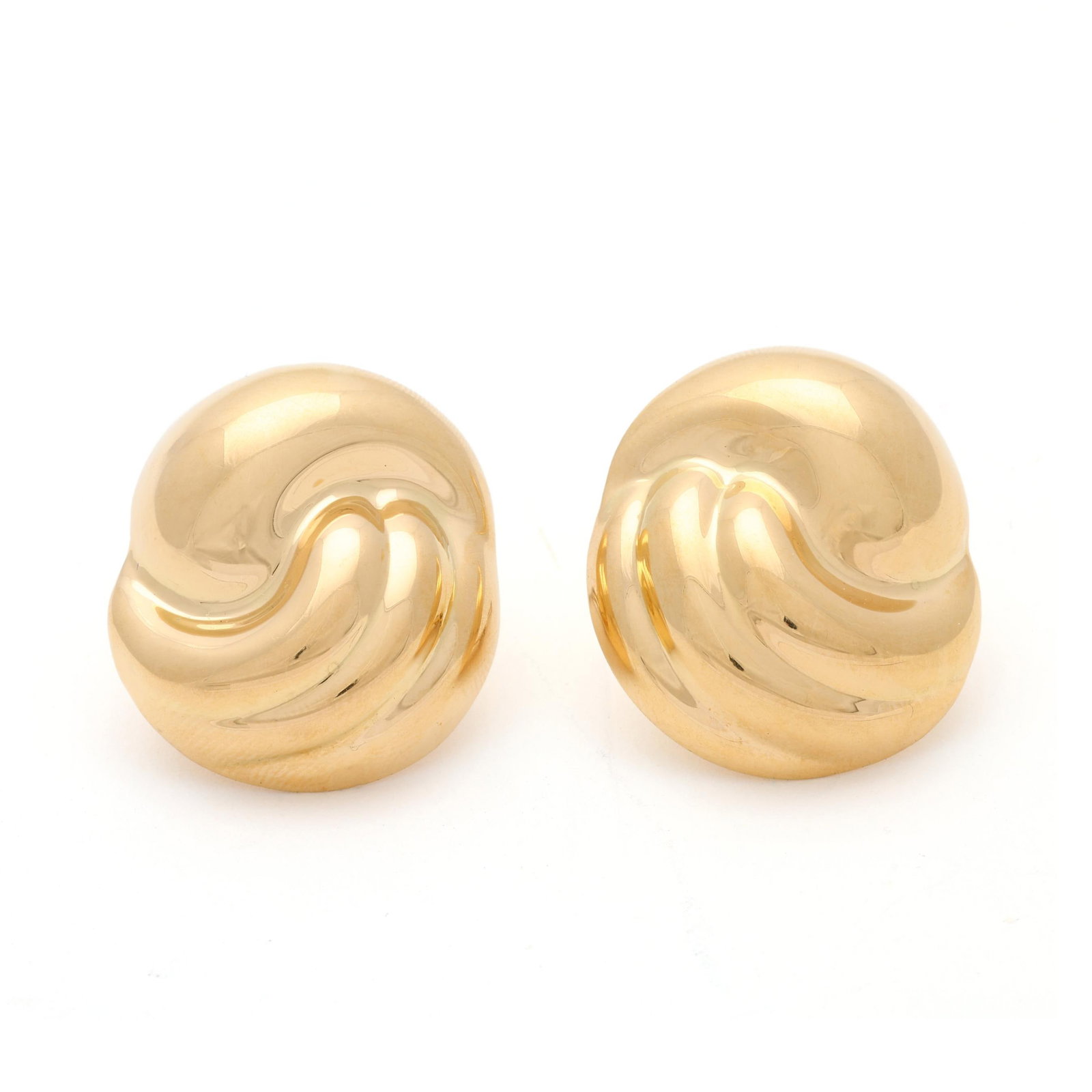 Gold Swirl Earrings, Italy: Gold Swirl Earrings, Italy the swirl motif earrings, completed with omega clip backs, stamped with maker's mark for Craiger Drake / 750 / Italy. 1 1/8 x 1 in. 6.8 dwt. Additional high-resolution photo