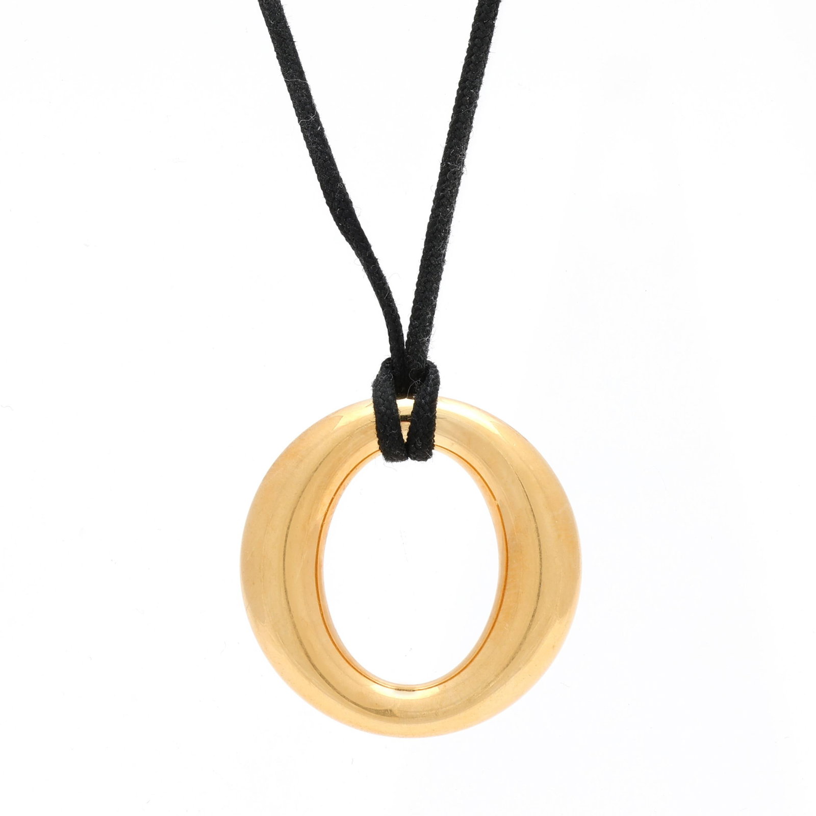 Gold Sevillana Pendant Necklace, Elsa Peretti for Tiffany & Co.: Gold Sevillana Pendant Necklace, Elsa Peretti for Tiffany & Co. the pendant in a ring design, suspended from a black cord necklace, signed Tiffany & Co. Elsa Peretti and stamped 750 Spain. Pendant 1 i