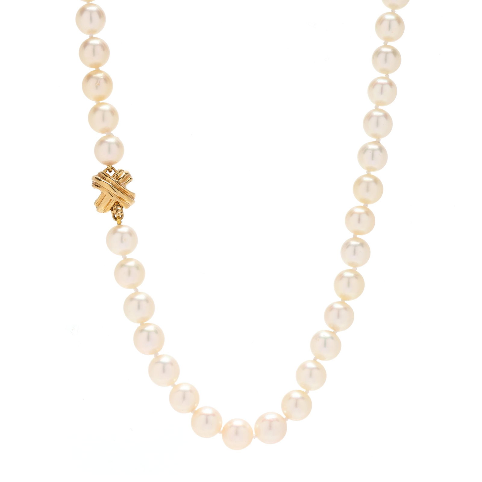 Single Strand Pearl Necklace, Tiffany & Co.: Single Strand Pearl Necklace, Tiffany & Co. strung knotted with (84) round cultured pearls (8.2mm to 8.6mm), and completed with a gold X design clasp, signed T&Co. and stamped 750. 30.75 in. 48.1 dwt.