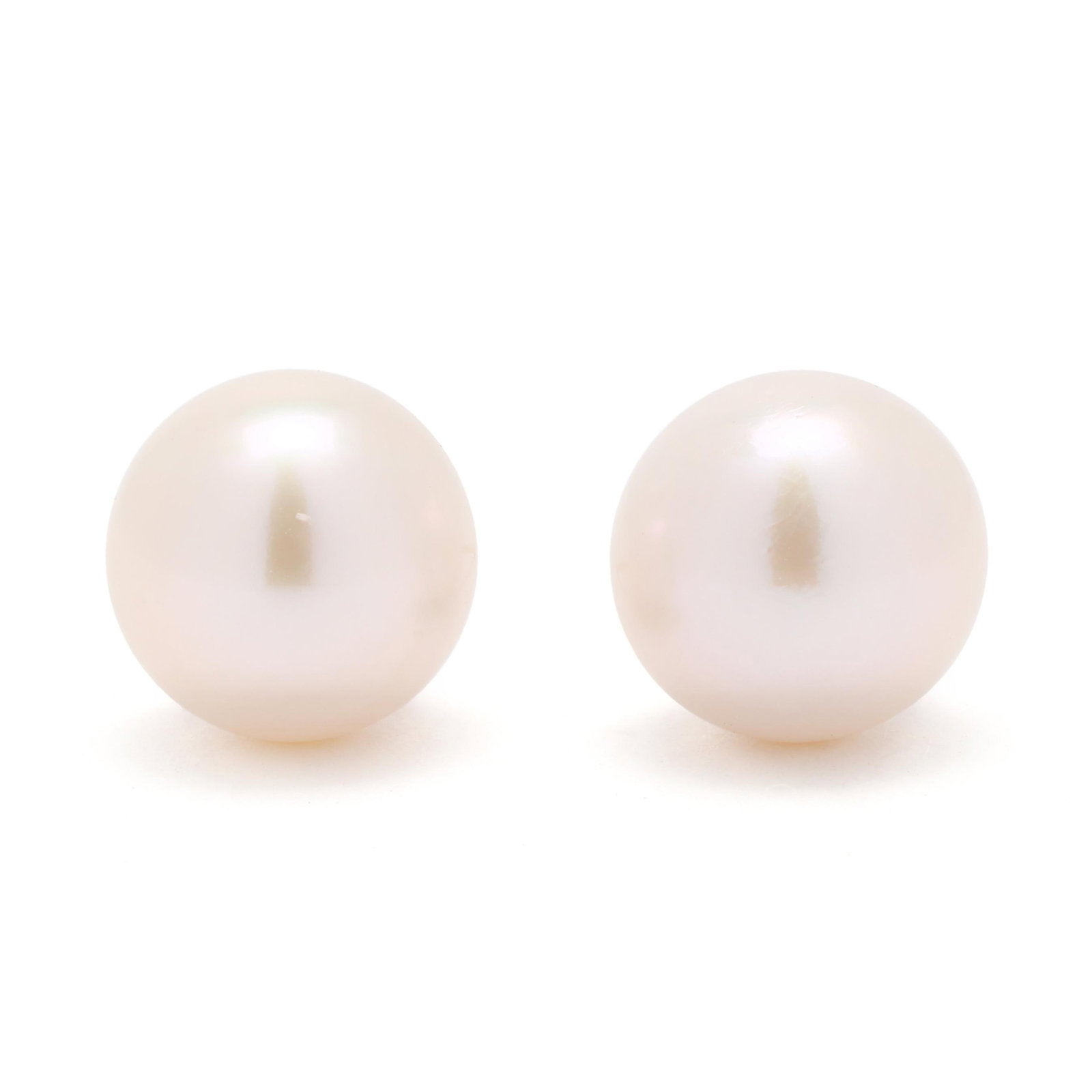 South Sea Pearl Stud Earrings: South Sea Pearl Stud Earrings the round cultured South Sea pearls (9.5mm; 9.7mm) completed with gold posts stamped Au750. 1.6 dwt. Pearls display a white bodycolor with green overtone, good luster, li