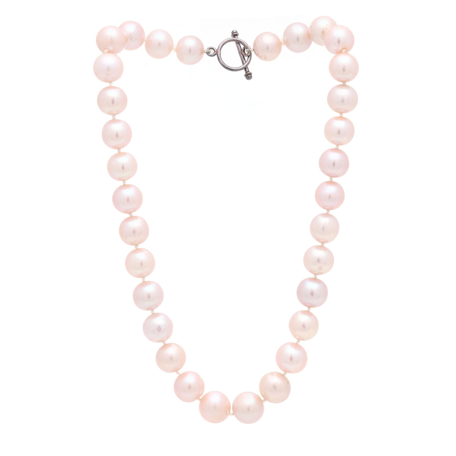 Strand of Pink South Sea Pearls: Strand of Pink South Sea Pearls strung knotted with (32) round pearls, completed with a silver toggle clasp, stamped 925. 18.25 in. 59.8 dwt. Pearls display a light pink hue, excellent luster, moderat