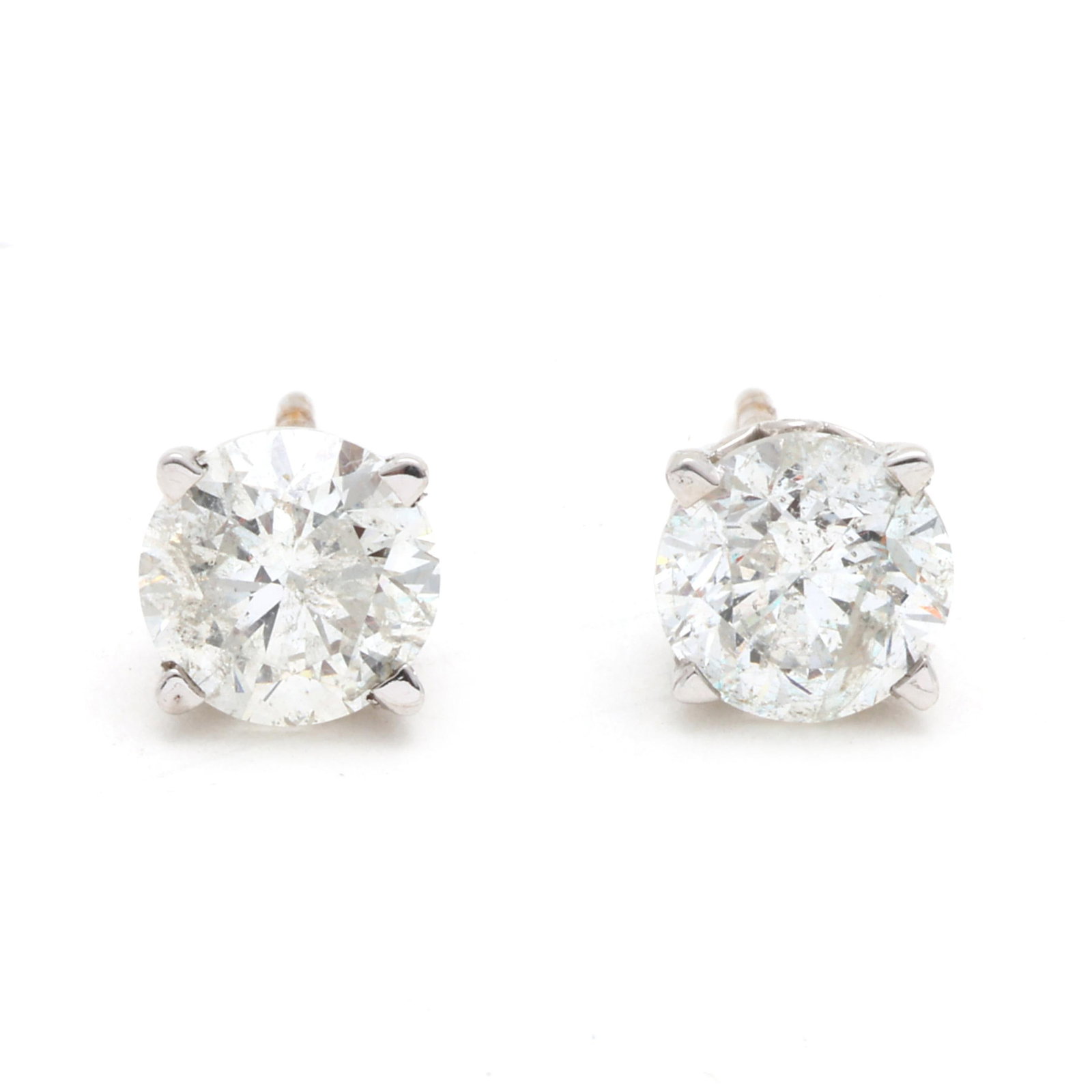White Gold and 2.46 Total Carat Diamond Stud Earrings: White Gold and 2.46 Total Carat Diamond Stud Earrings the full cut round diamonds (6.59 - 6.64mm; 6.55 - 6.59mm) weighing approximately 1.26 carat and 1.20 carat (E color, I2 clarity; E color, I2 clar