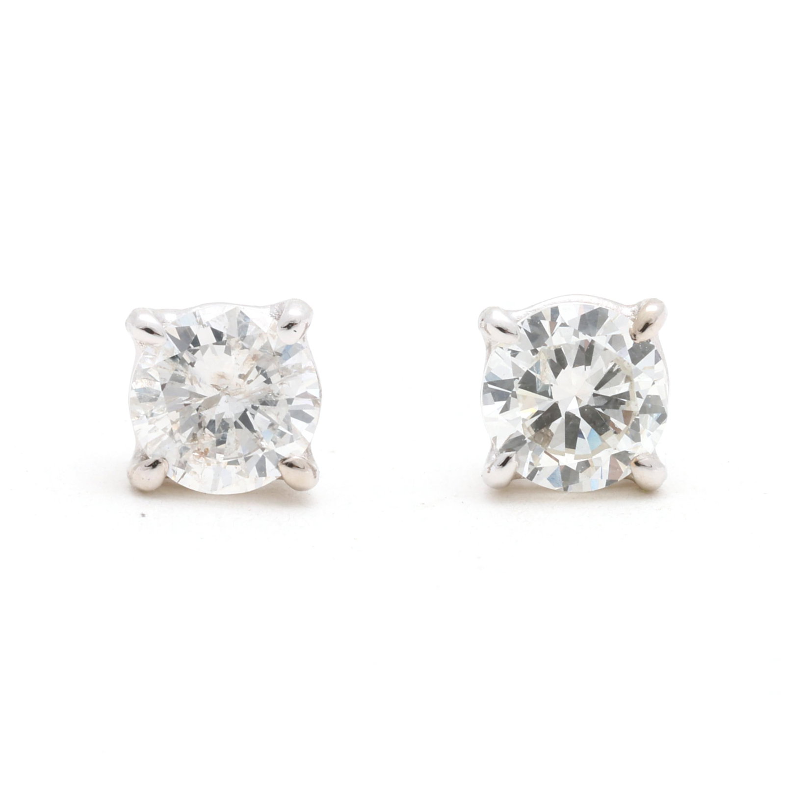 White Gold and .54 Total Carat Diamond Stud Earrings: White Gold and .54 Total Carat Diamond Stud Earrings the full cut round diamonds (4.24 - 4.26mm; 4.20 - 4.23 mm) weighing approximately .28 carat and .26 carat (F color, I1 clarity; H color, I1 clarit