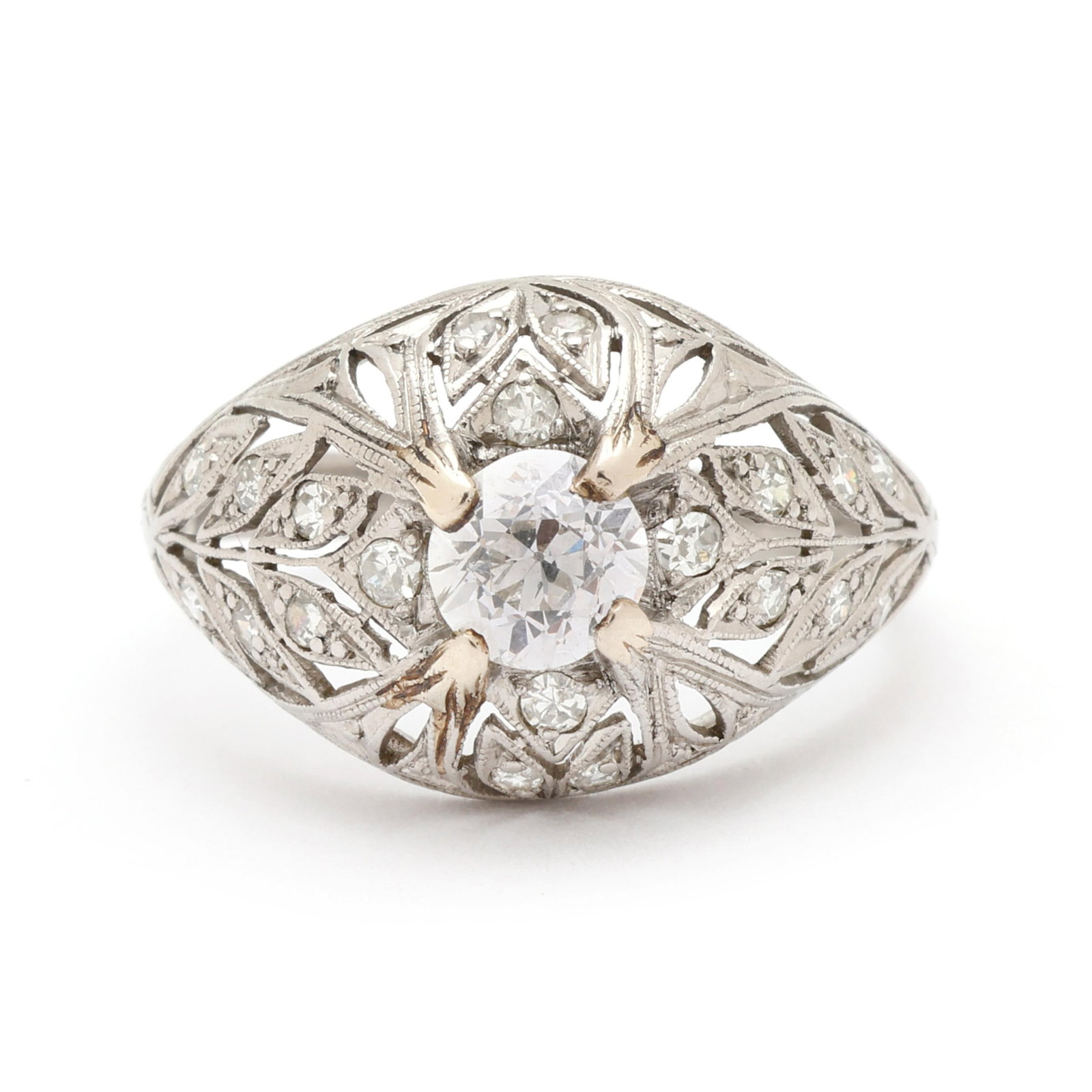 Antique Platinum and Diamond Ring: Antique Platinum and Diamond Ring centered on an old European cut diamond (5.10 - 5.20 x 3.48mm) weighing approximately .63 carat (F color, SI1 clarity), with foliate motif openwork surround set with
