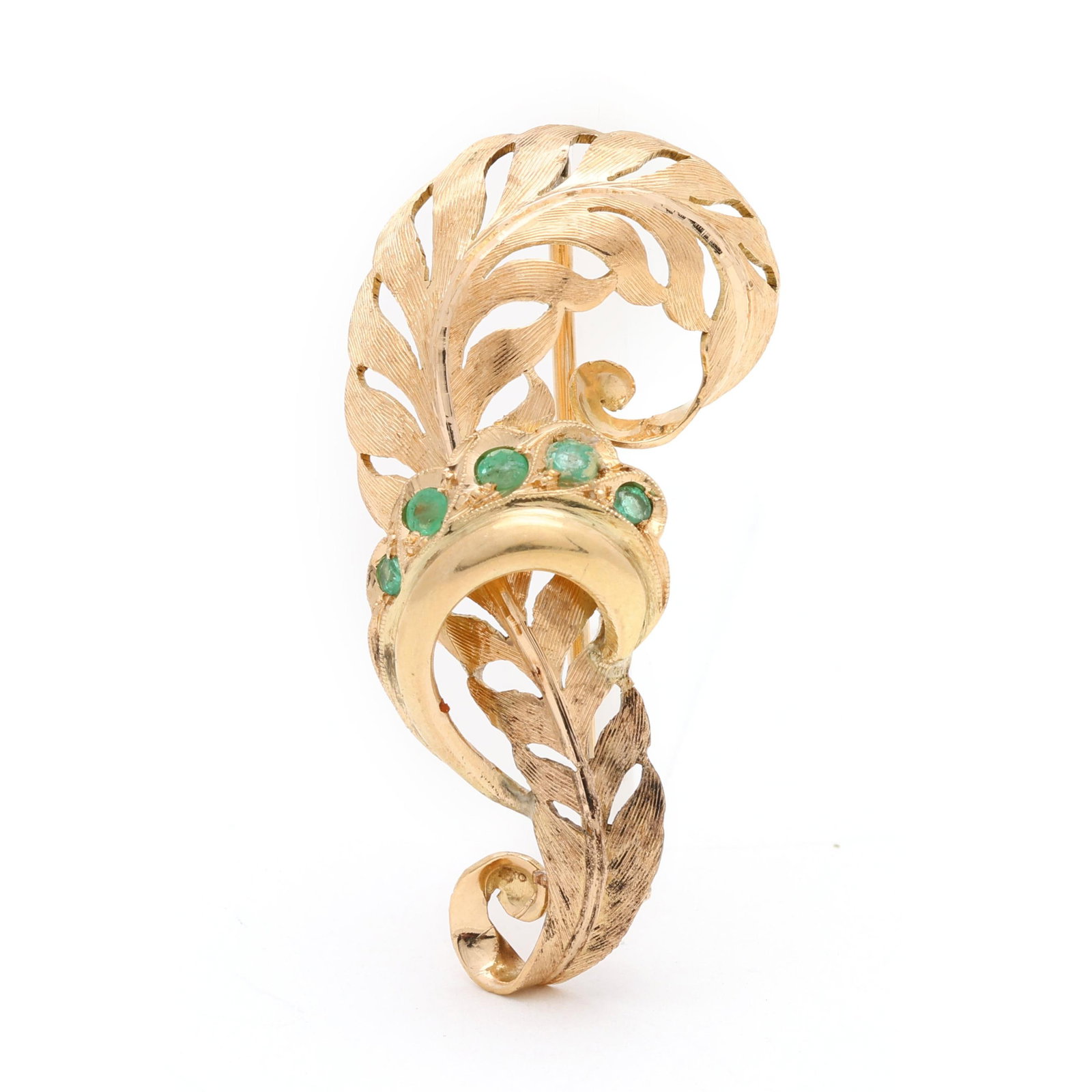 Gold and Emerald Feather Brooch: Gold and Emerald Feather Brooch the gold feather brooch in scrolled form, set with round cut emeralds, completed with a pin stem, stamped 750 and with Italian registry 6 BO. 1.5 x .75 in. 3.8 dwt.