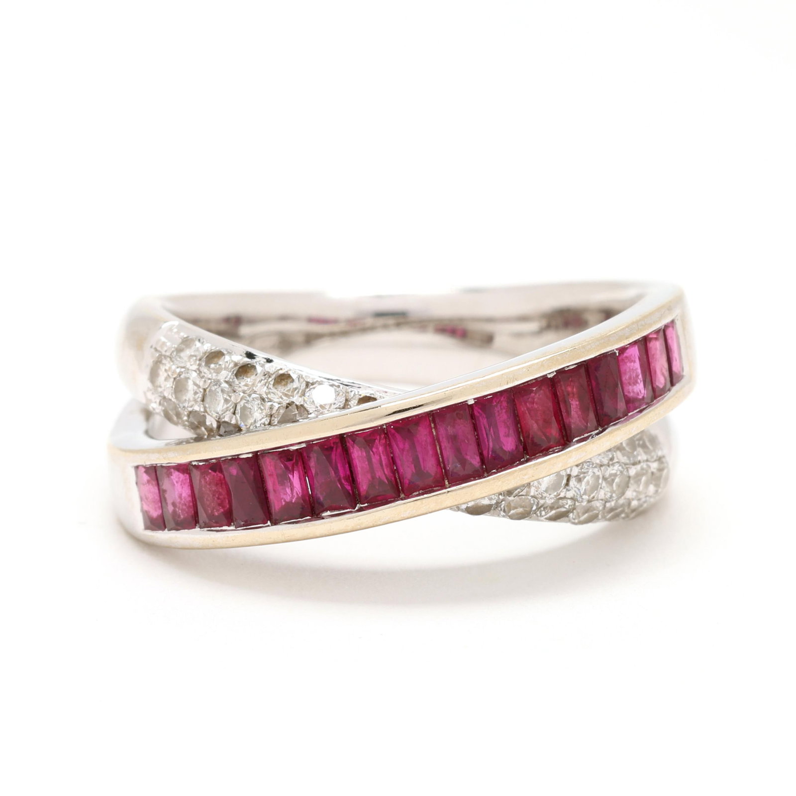 White Gold, Ruby, and Diamond Bypass Ring: White Gold, Ruby, and Diamond Bypass Ring in a bypass design channel set with rectangular cut rubies and pavé set with full cut round diamonds weighing approximately .65 total carat (G-H color,
