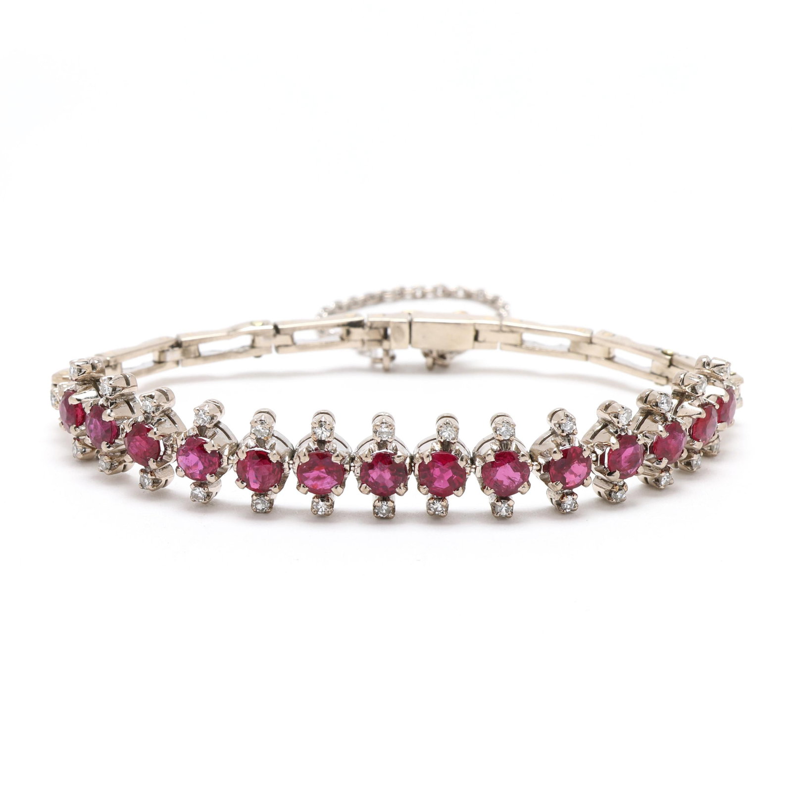 Gold Over Silver, Ruby, and Diamond Bracelet: Gold Over Silver, Ruby, and Diamond Bracelet the links set with round cut rubies, weighing approximately 4.2 total carats, and single cut round diamonds weighing approximately .50 total carat (H-I