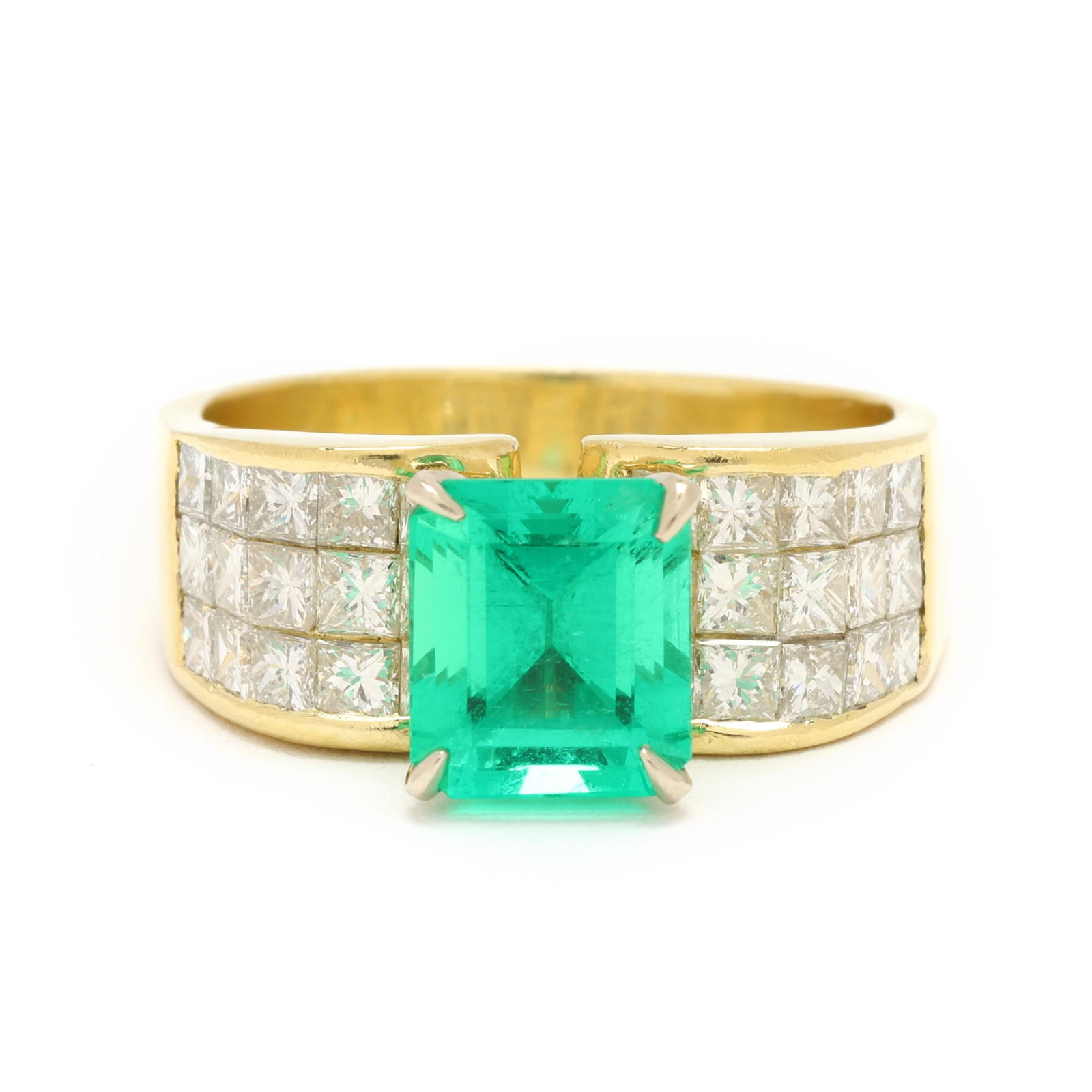 Gold, Emerald, and Diamond Ring: Gold, Emerald, and Diamond Ring centered on a prong set emerald cut emerald (8.13 x 7.06mm) weighing approximately 2.25 carats, the convex shoulders invisibly set with princess cut diamonds weighing a