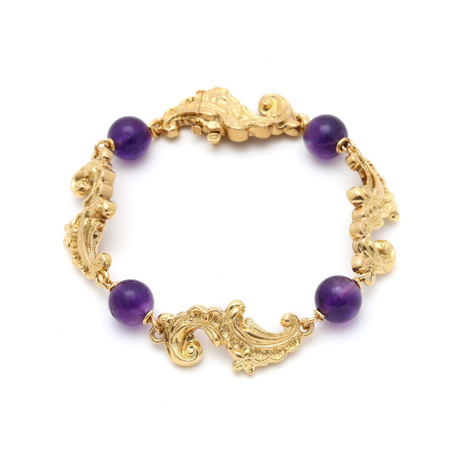 Gold and Amethyst Bead Bracelet: Gold and Amethyst Bead Bracelet paisley motif link bracelet with polished amethyst beads (9mm), completed with an integrated box clasp and safety, and stamped 18K. 15mm x 7.25 in. 15.3 dwt.