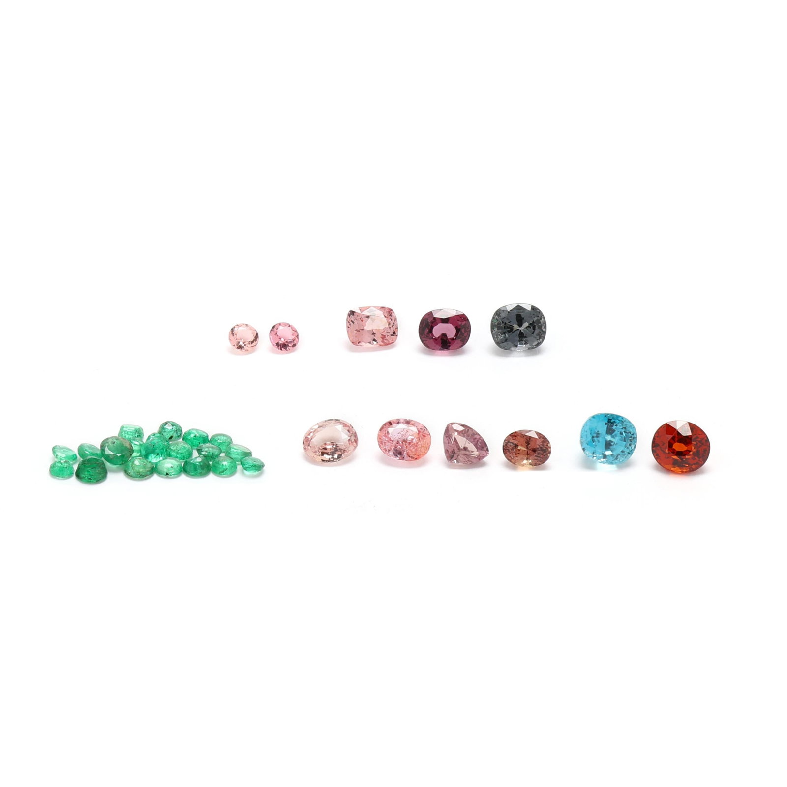 Group of Loose Gemstones: Group of Loose Gemstones to include: an oval cut zircon weighing 4.38 carats (actual); a group of pink to pinkish orange sapphires weighing 6.23 total carats (actual); a group of multi-color spinels w
