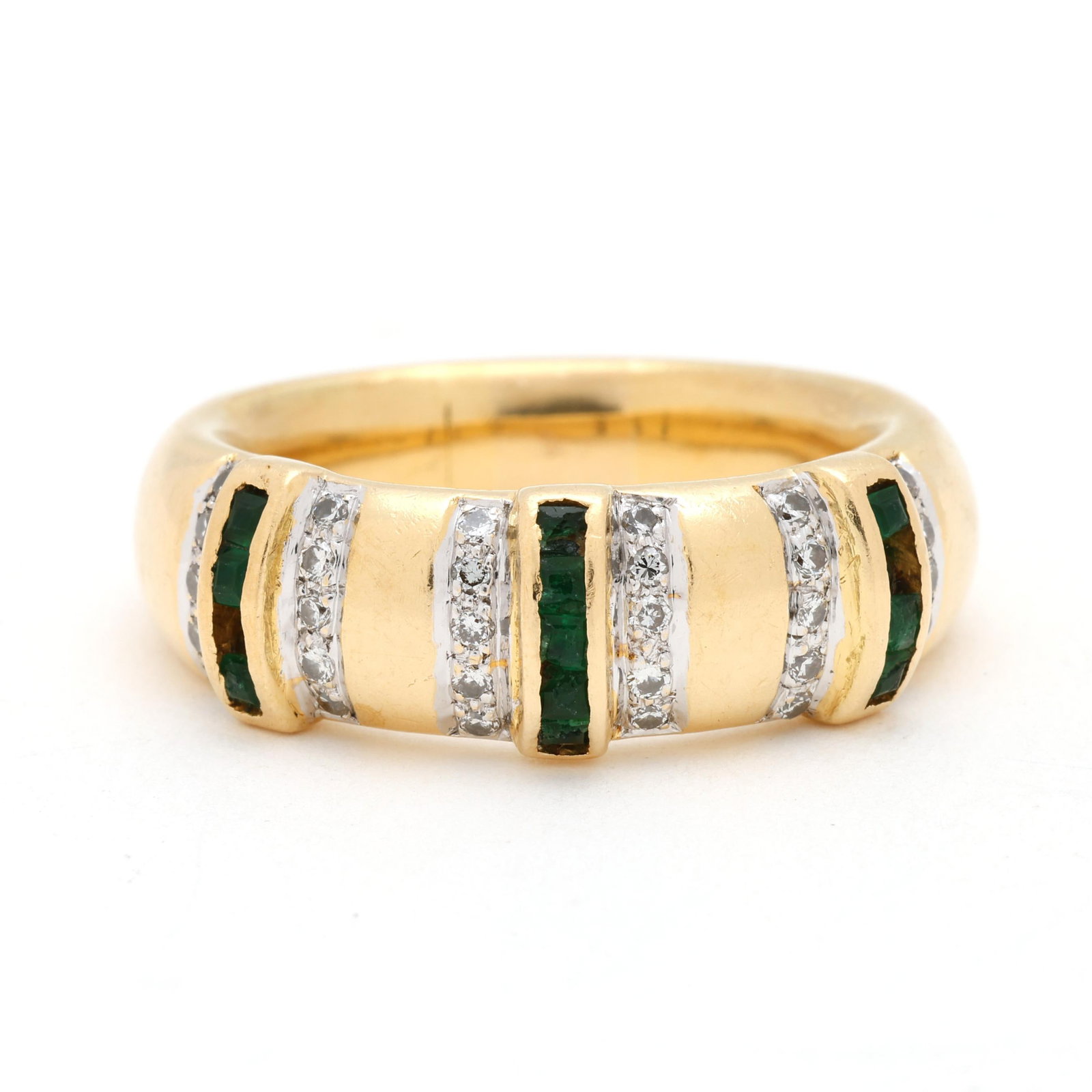 Gold, Diamond, and Emerald Band: Gold, Diamond, and Emerald Band the rounded high polish band set with three raised rows of square cut emeralds, each row flanked by bead set full cut round diamonds weighing approximately .30 total ca