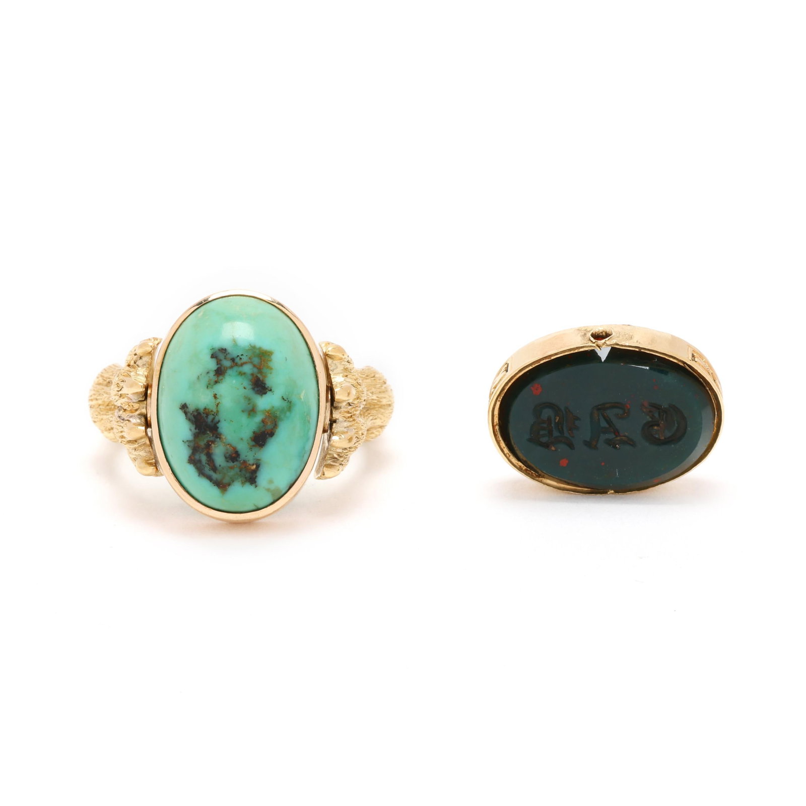 Gold Convertible Charm Ring with Two Charms: Gold Convertible Charm Ring with Two Charms the gold ring in the form of a lions paw with scrolled motif with two charms, to include: one with an oval cabochon cut turquoise, bezel set in gold,