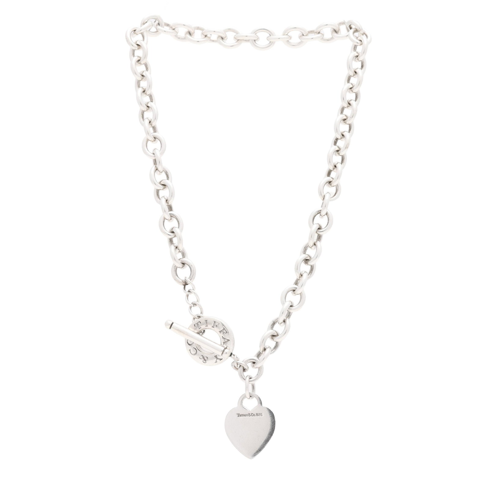 Silver Heart Charm Necklace, Tiffany & Co.: Silver Heart Charm Necklace, Tiffany & Co. the silver cable link chain suspending a heart charm, signed and stamped 925, completed with a signed toggle clasp. Charm 1.25 in.; Necklace 10mm x 16 in.