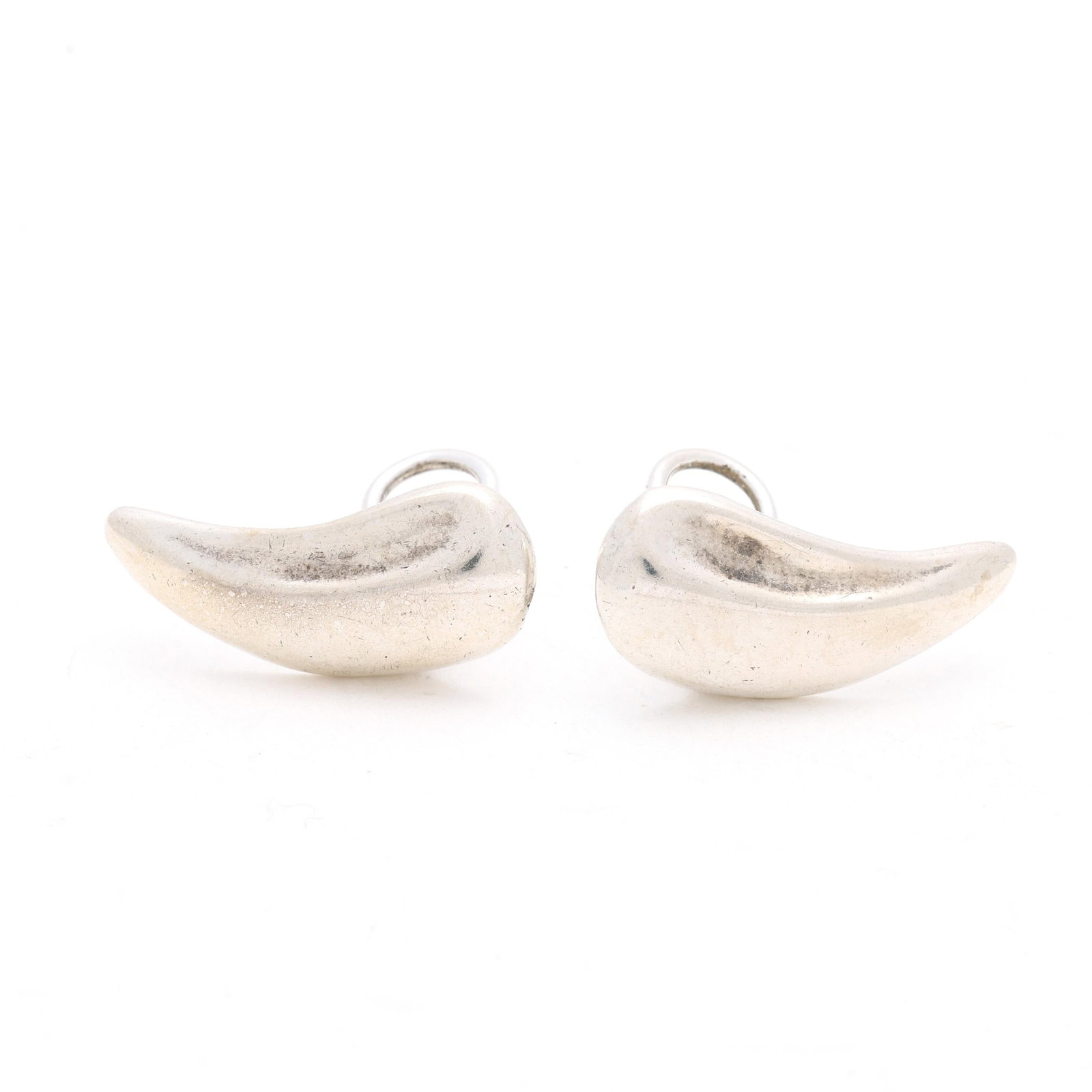 Silver Ear Clips, Elsa Peretti for Tiffany & Co.: Silver Ear Clips, Elsa Peretti for Tiffany & Co. the modernist silver ear clips completed with omega clip backs, stamped with partial signature and Sterling. .5 x 1 in. 0.175 troy oz. Additional