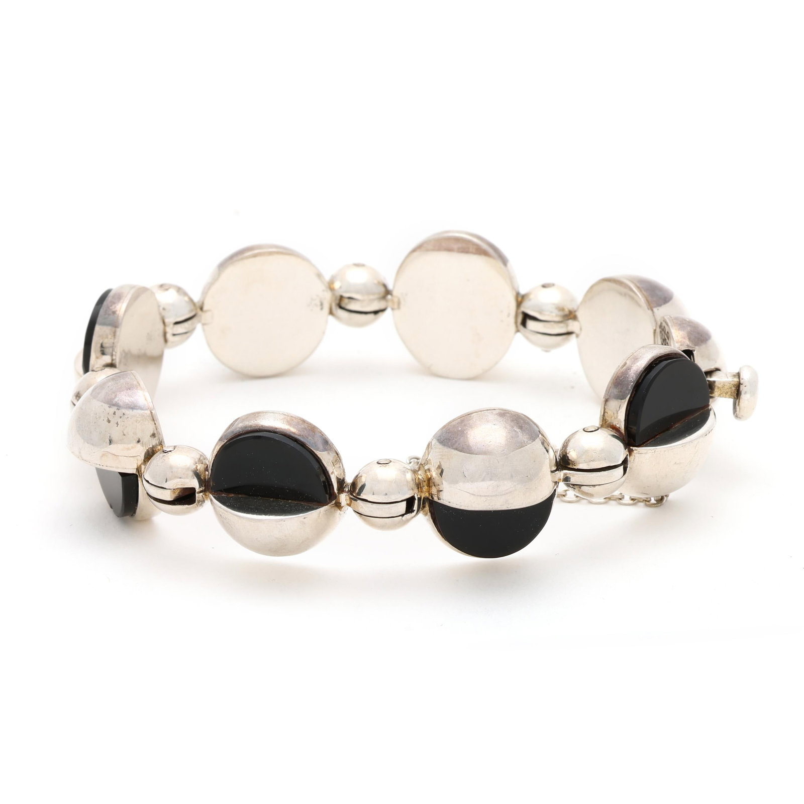 Silver and Black Onyx Bracelet, Antonio: Silver and Black Onyx Bracelet, Antonio in modernist design, with circular links, demilune set with black onyx, completed with an integrated clasp and safety chain, stamped with maker's mark, Eagle 21