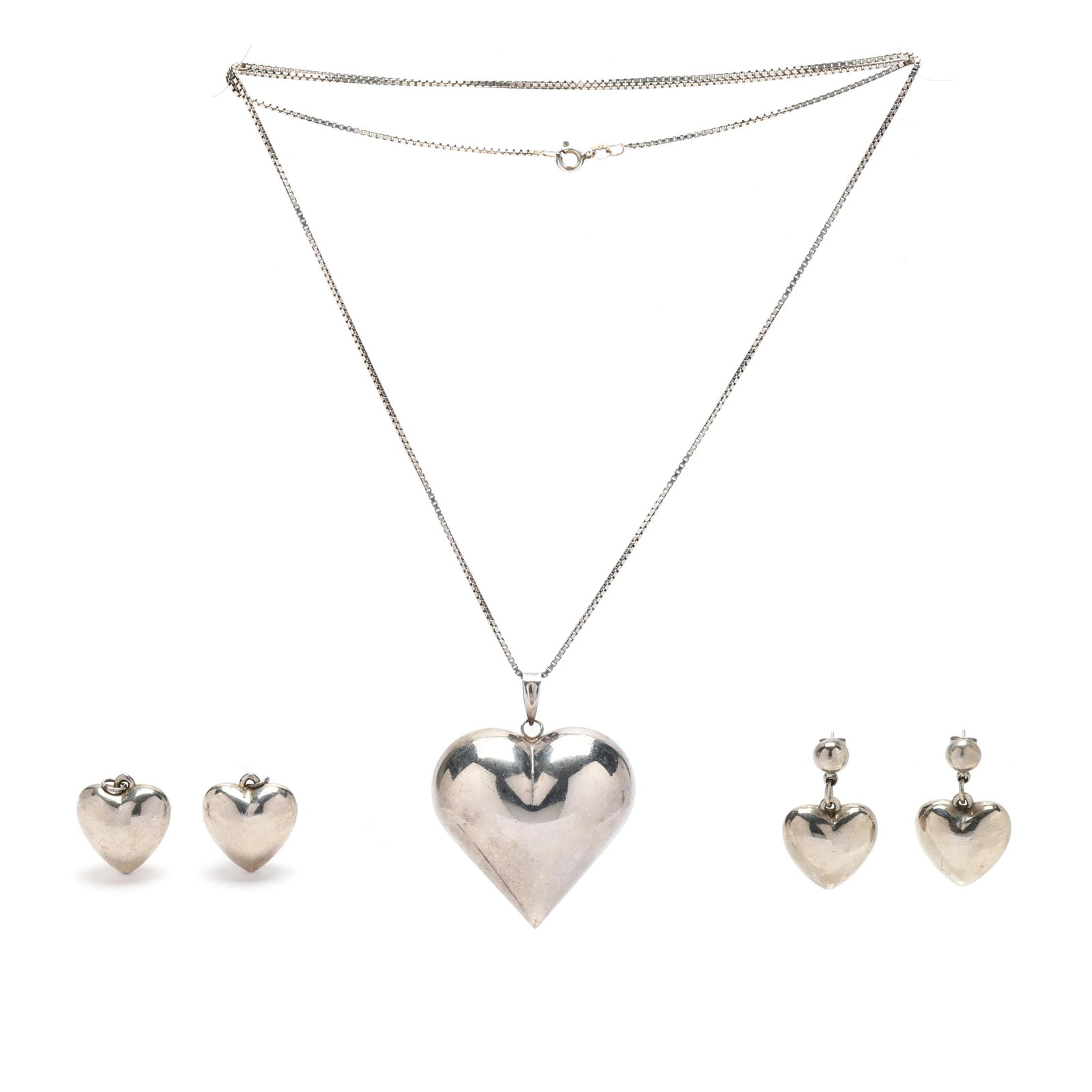 Group of Silver-Tone Copper Heart Jewelry: Group of Silver-Tone Copper Heart Jewelry to include: a pair of earrings with dome-shaped studs suspending a three-dimensional heart dangle, completed with posts and push backs (1 3/8 x 13/16 in.); a 