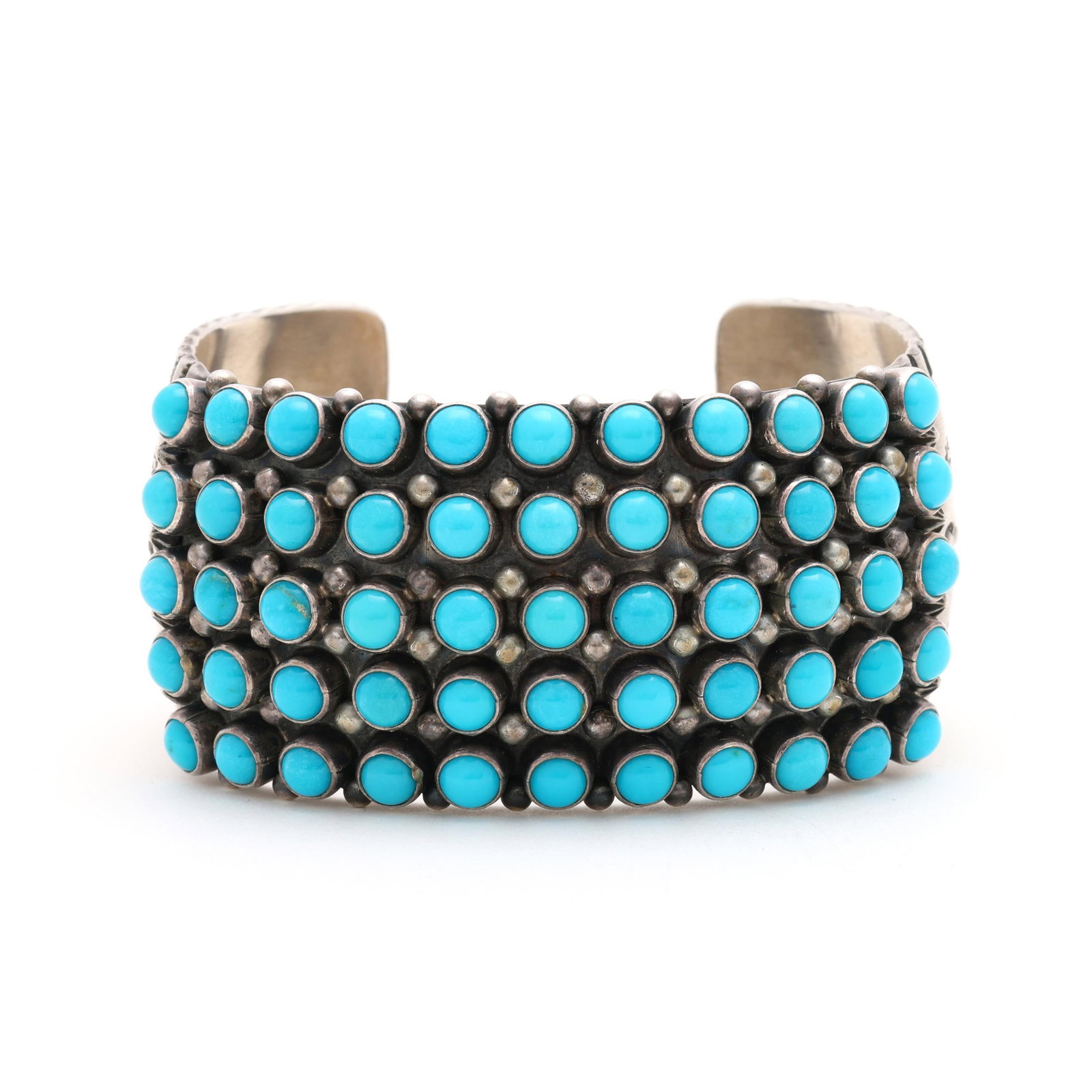 Silver and Turquoise Cuff Bracelet, Aaron Toadlena: Silver and Turquoise Cuff Bracelet, Aaron Toadlena the cuff bracelet set with (55) round cabochon cut turquoise, geometric stamp work patterns, stamped 925 and with Aaron Toadlena mark. 1.25 x 5.75