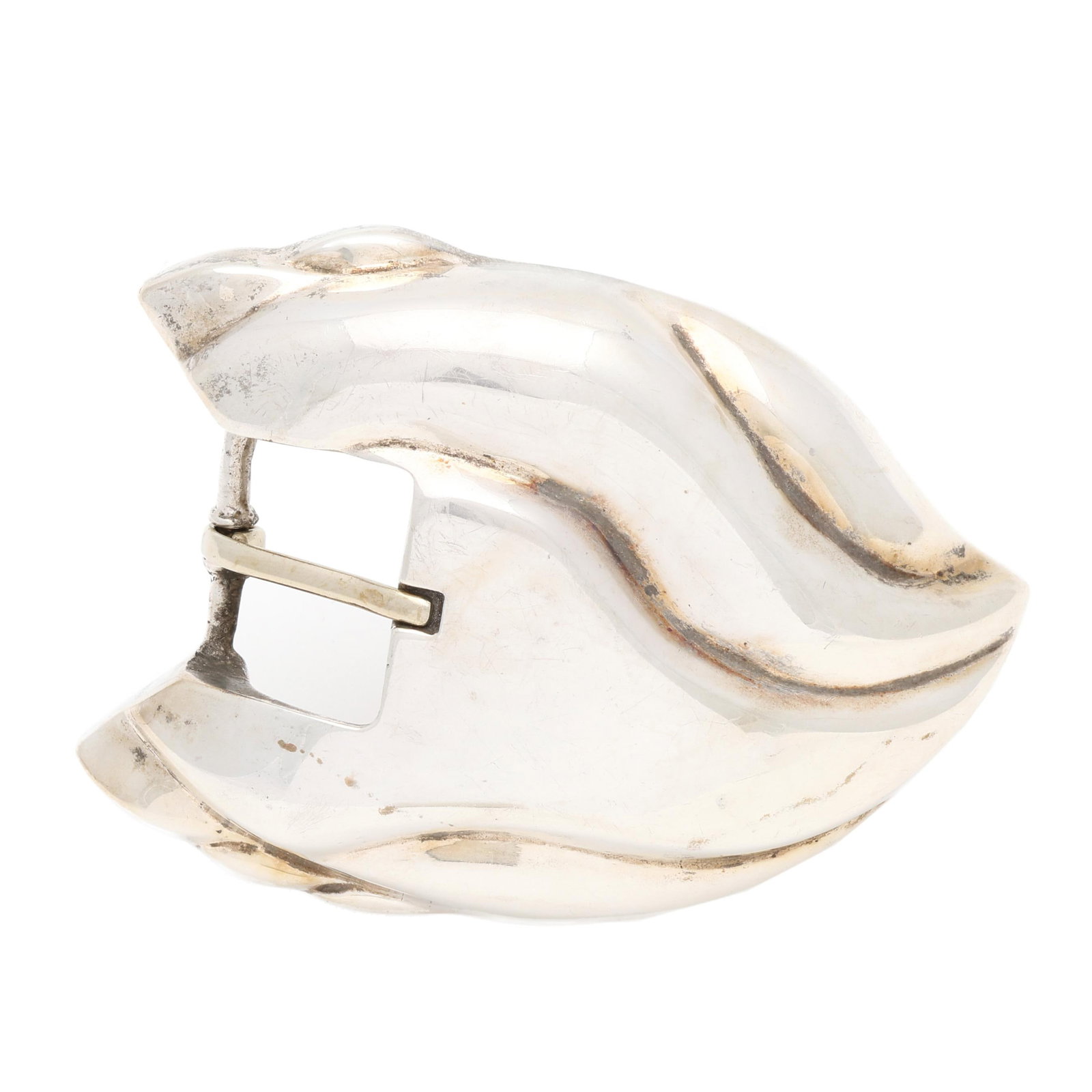 Silver Belt Buckle, J. Deegan: Silver Belt Buckle, J. Deegan in a large, sculptural design, with raised, wave-like striations, stamped Ster. and with maker's mark. 2 11/16 x 4 in. 3.22 troy oz. Good estate condition. Additional hig