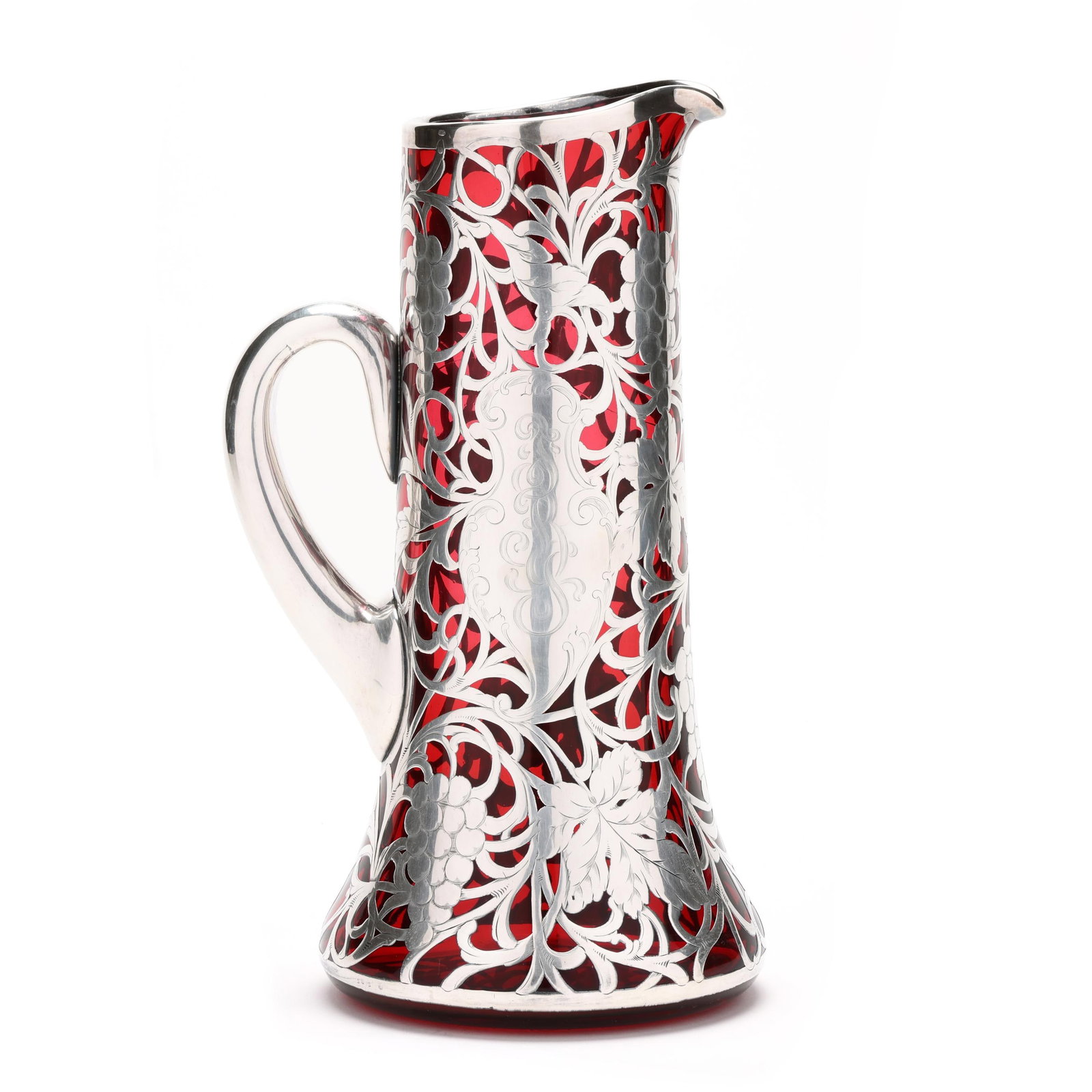 Large Sterling-Silver Deposit Ruby Glass Pitcher: Large Sterling-Silver Deposit Ruby Glass Pitcher early 20th century, tall pitcher with applied handle, grapevine motif silver deposit with monogrammed cartouche, the silver marked Sterling Silver Depo
