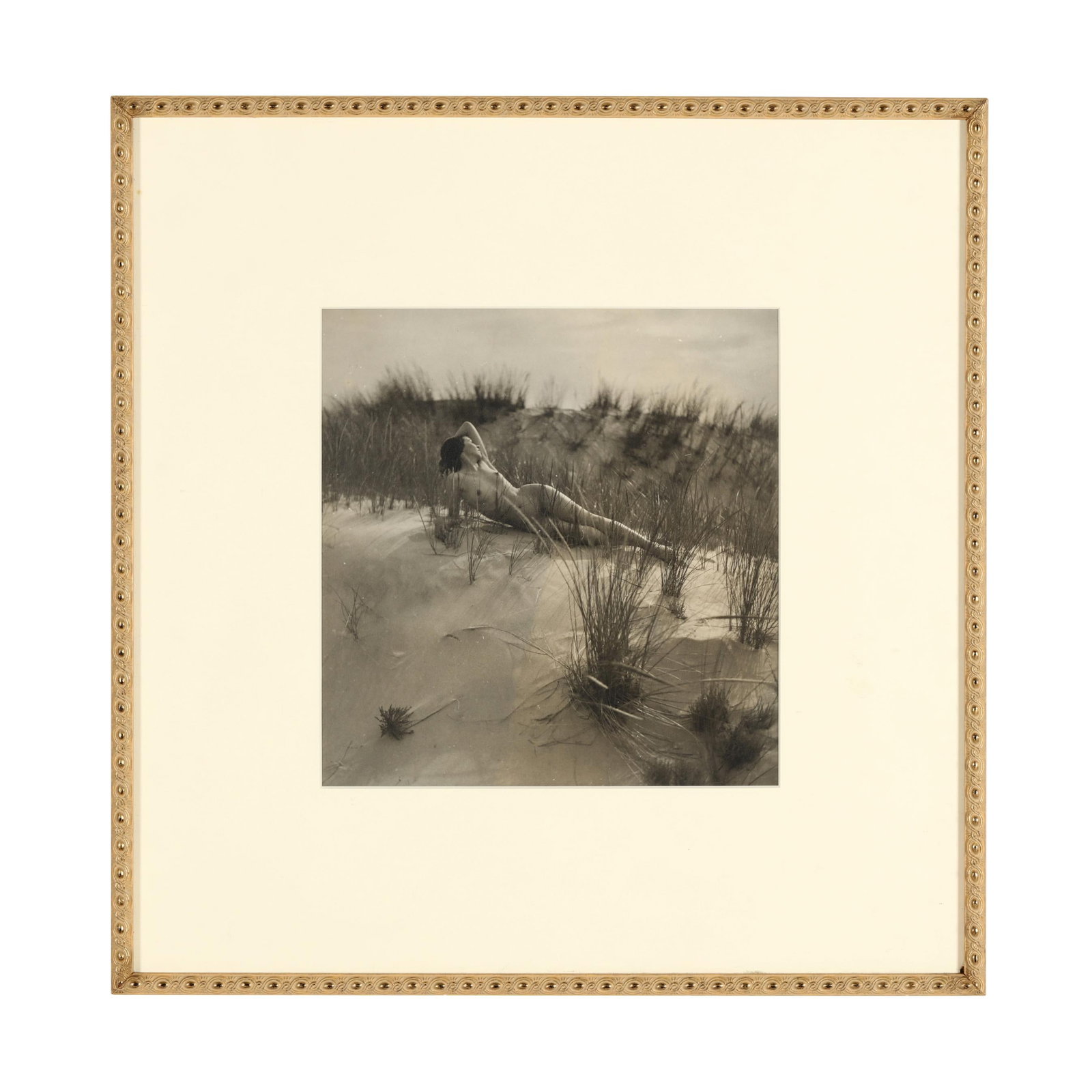 Eleanor Parke Custis (American, 1897-1983), Untitled (Reclining Nude in Sand Dunes): Eleanor Parke Custis (American, 1897-1983), Untitled (Reclining Nude in Sand Dunes) gelatin silver print, 1930s, stamped to the verso, matted and framed below glass. Sight size 11 x 10 1/2 in.; Frame 