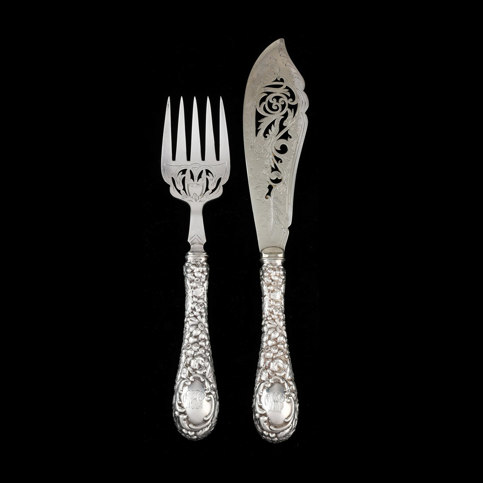 The Stieff Company Repousse Sterling Silver Fish Set: The Stieff Company Repousse Sterling Silver Fish Set Baltimore, circa 1914, with stainless steel blades made in England, featuring hand-chased floral decoration to the handles, script monograms, and e