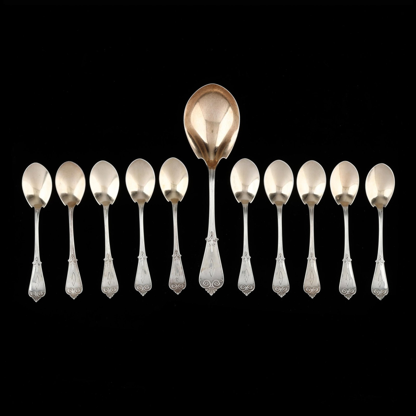 Tiffany & Co. Tiffany Sterling Silver Ice Cream Service: Tiffany & Co. Tiffany Sterling Silver Ice Cream Service period mark circa 1907-1947, directorship of John C. Moore II, includes a large spoon (9 in.); and (10) spoons (6 in.); all with gold wash and a