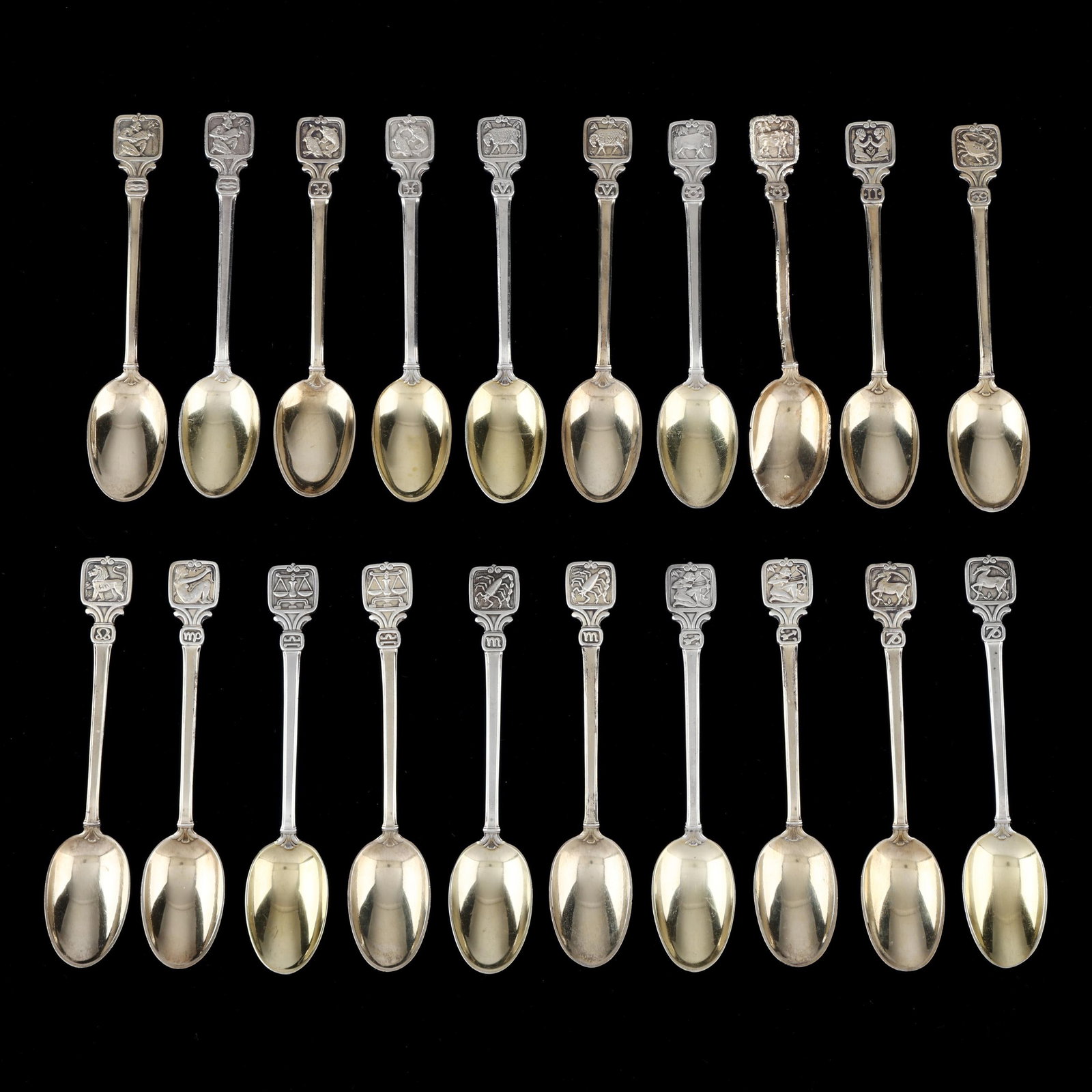 Collection of Twenty Tiffany & Co. Parcel Gilt Sterling Silver Zodiac Demitasse Spoons: Collection of Twenty Tiffany & Co. Parcel Gilt Sterling Silver Zodiac Demitasse Spoons period marks circa 1907-1947, directorship of John C. Moore II, includes a full set of (12) and partial set of (8