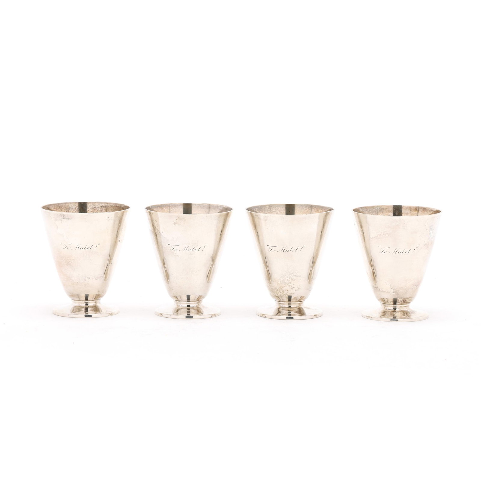Set of Four Tiffany & Co. Sterling Silver Cocktail Cups: Set of Four Tiffany & Co. Sterling Silver Cocktail Cups period mark circa 1907-1947, directorship of John C. Moore II, pattern number 20454, all engraved "To Mabel!". Each 3 x 2 1/2 in. dia. 13.05 tot