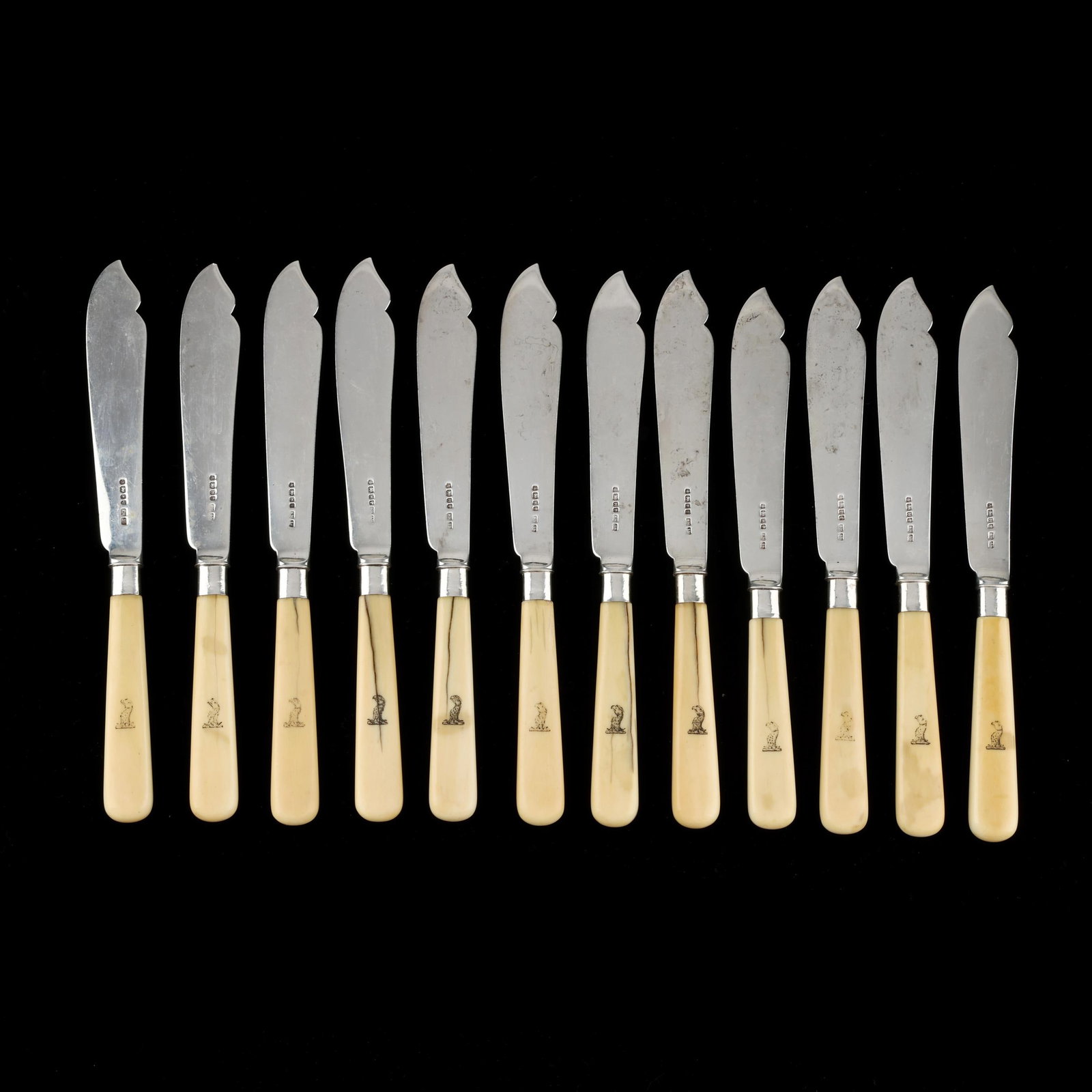 Set of Twelve Victorian Silver Fish Knives, Mark of Mappin Brothers: Set of Twelve Victorian Silver Fish Knives, Mark of Mappin Brothers Sheffield (1875), solid silver blades with engraved eagle head monograms to the handles. 8 7/8 in. Additional high-resolution photos