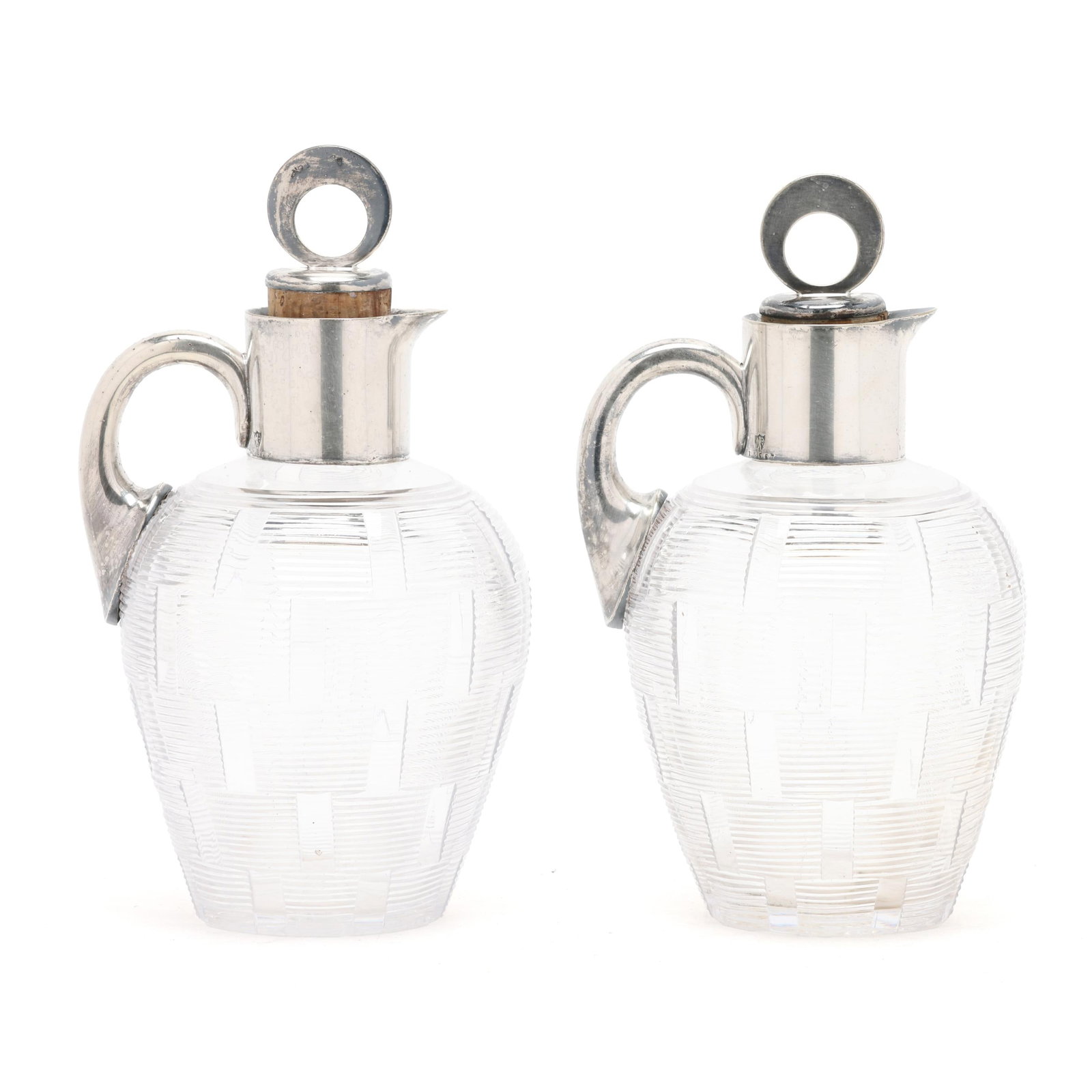 Pair of English Silver-Plated and Crystal Decanters, Mark of John Grinsell & Sons: Pair of English Silver-Plated and Crystal Decanters, Mark of John Grinsell & Sons Birmingham, circa 1971-1907, pattern number 13557, featuring cut striations to the crystal and a circular finial; not 