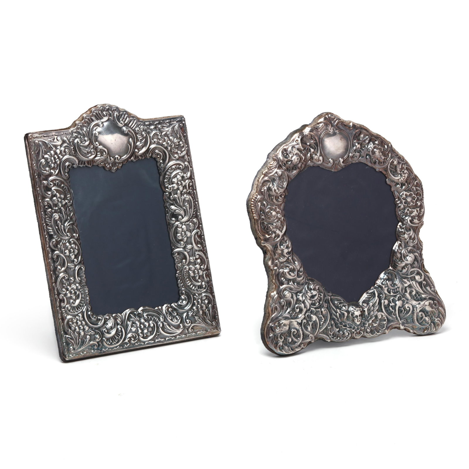 Two Elizabethan Silver Picture Frames, Mark of Carr's of Sheffield Ltd.: Two Elizabethan Silver Picture Frames, Mark of Carr's of Sheffield Ltd. Sheffield (1994) and (1998), the first, with a heart shaped opening with rocaille decorated surround (11 x 10 in.); the second,