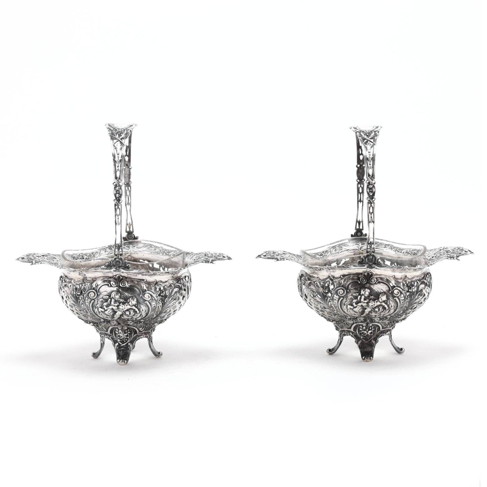 Pair of German Silver Reticulated Baskets: Pair of German Silver Reticulated Baskets late 19th century, marked "800" with worn maker and crown hallmarks to the handle and body, without monograms, of lobed footed form with everted lobed rim